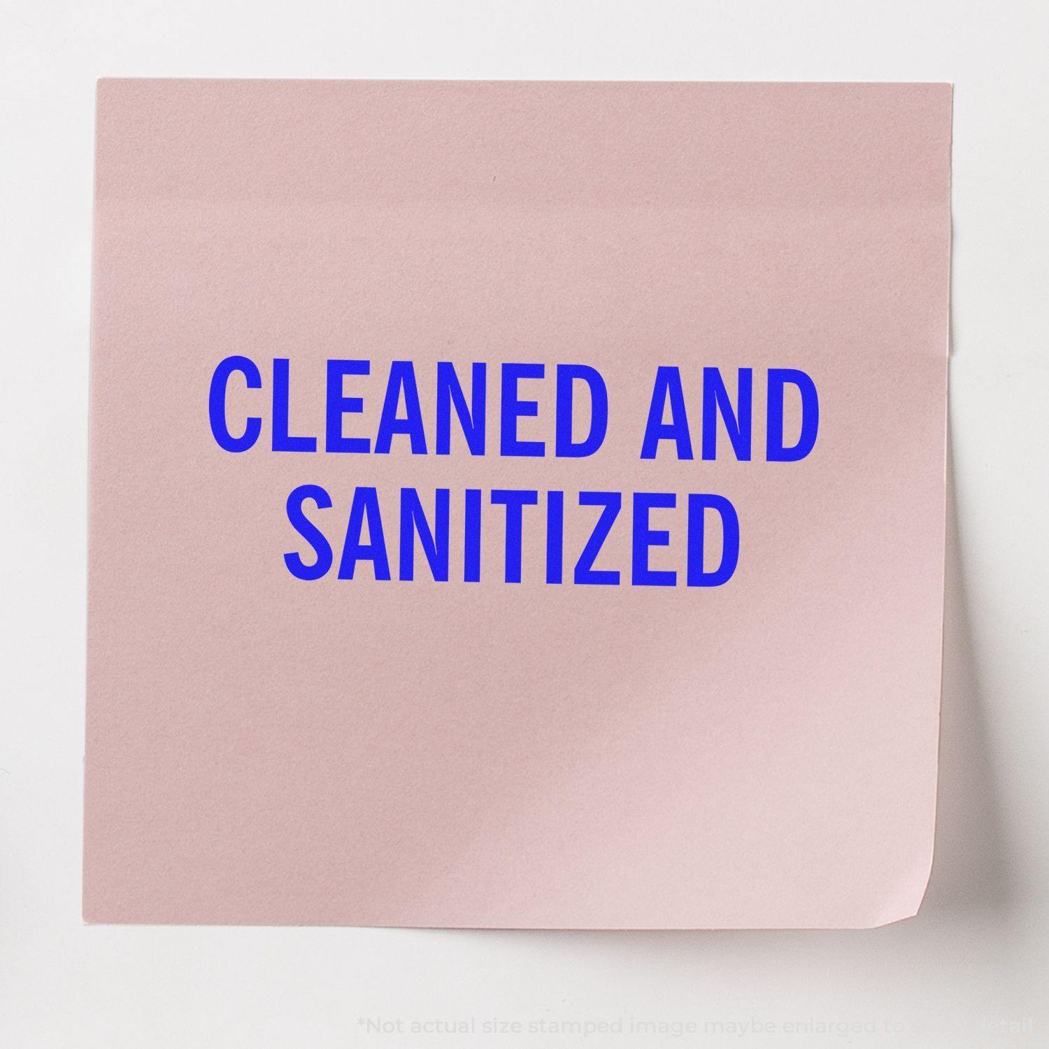 Large Pre-Inked Cleaned and Sanitized Stamp used on a pink paper, displaying the text CLEANED AND SANITIZED in blue.