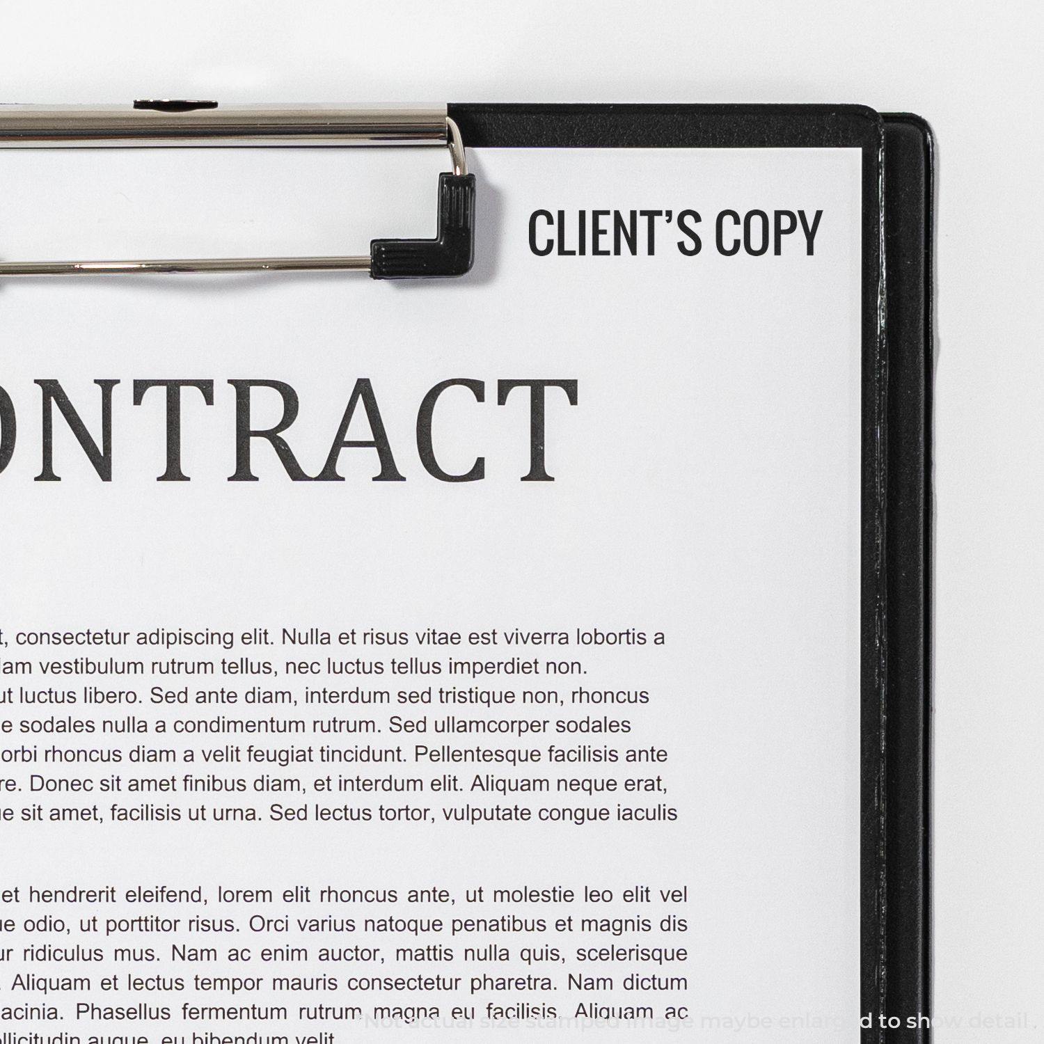 A Large Pre-Inked Client's Copy Stamp is used on a contract document clipped to a black clipboard, with the text CLIENT'S COPY visible.