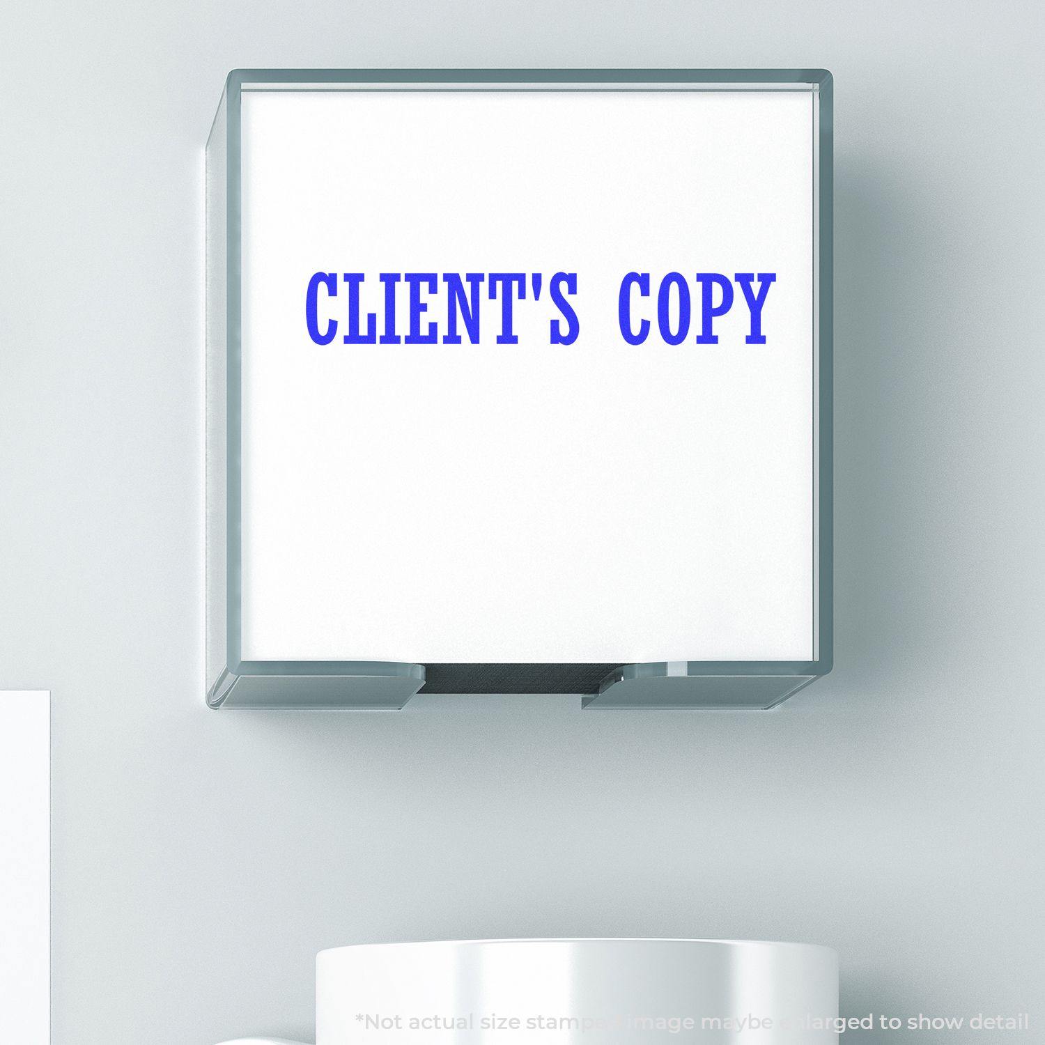 Self Inking Clients Copy Stamp in use, showing the text CLIENT'S COPY in blue on a white background.