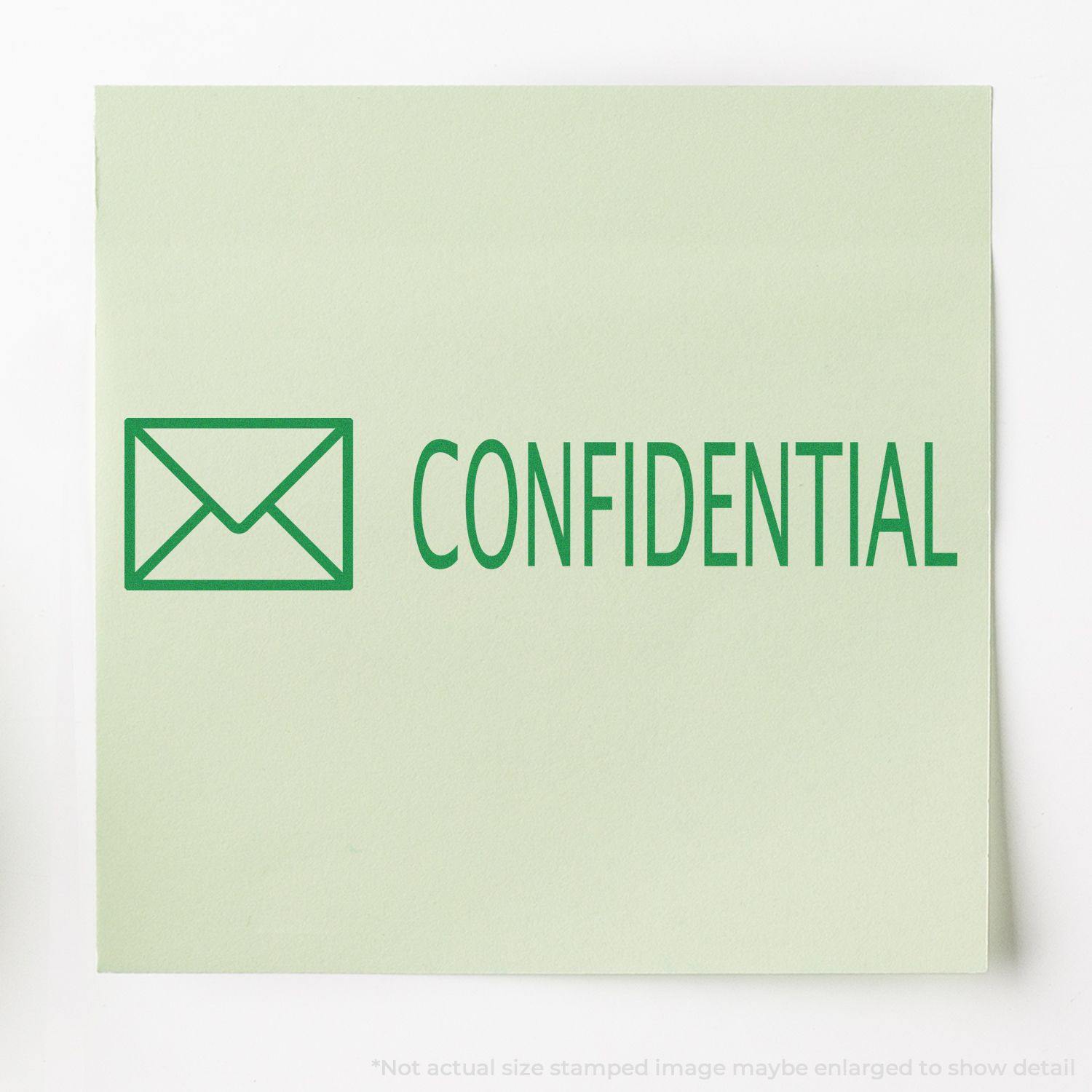 Large Confidential with Envelope Rubber Stamp imprint in green on a light green paper, showing an envelope icon and the word CONFIDENTIAL .