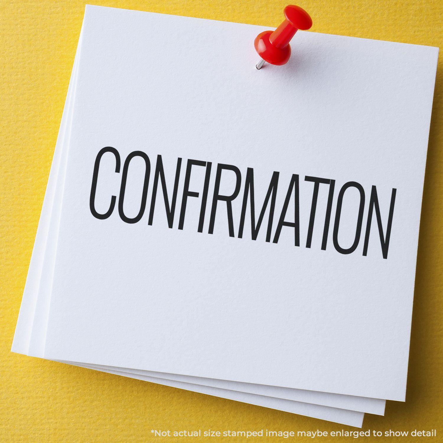 Confirmation Rubber Stamp used on white paper pinned to a yellow board with a red pushpin. Text reads CONFIRMATION in bold black letters.