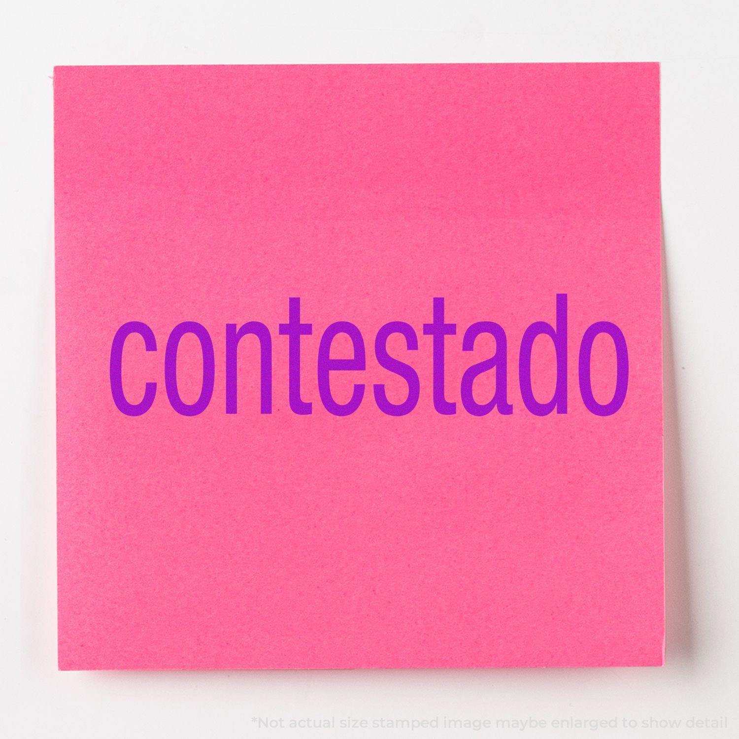 Pink sticky note with the word contestado stamped in purple using the Contestado Rubber Stamp.