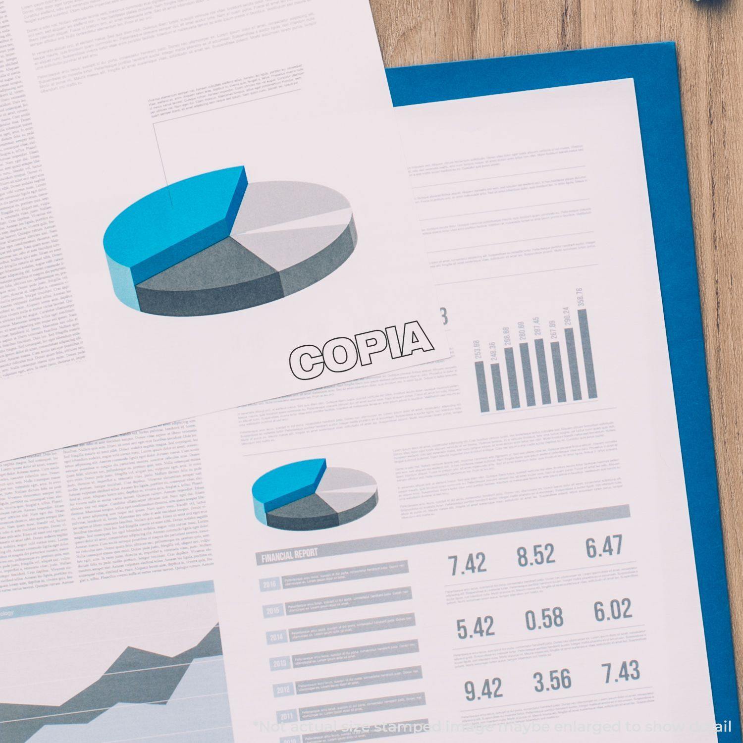 Copia Rubber Stamp used on a financial report with pie charts and graphs, highlighting the stamped word Copia on the document.