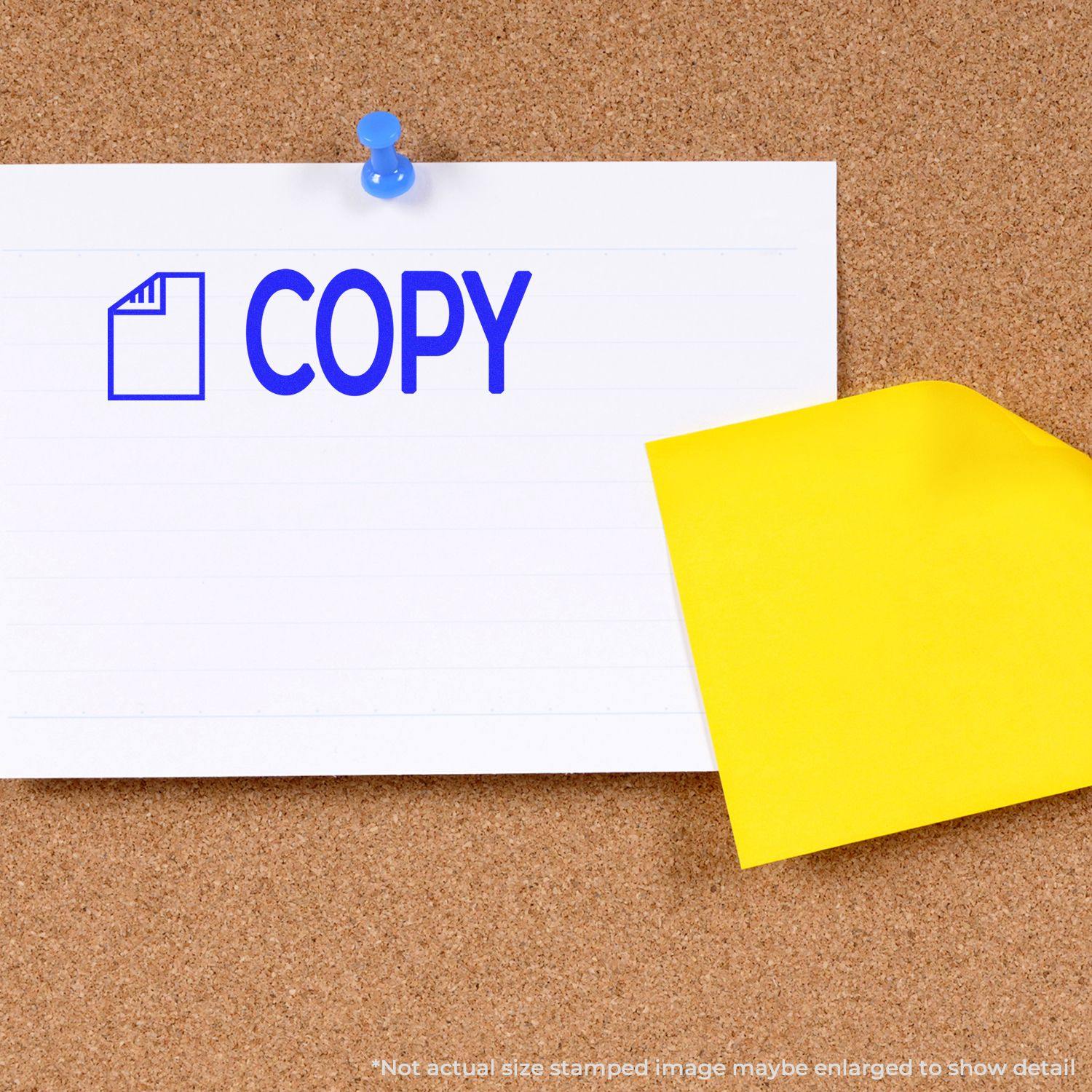 A corkboard with a white paper stamped COPY using the Copy with Letter Rubber Stamp, pinned with a blue pushpin, and a yellow sticky note.