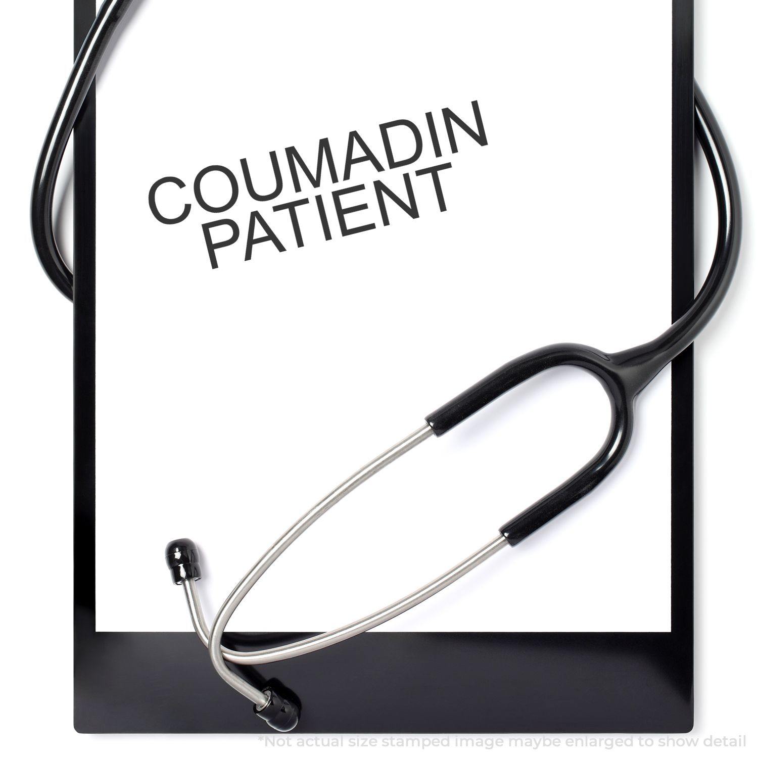 A clipboard with a stethoscope and a paper stamped with COUMADIN PATIENT using the Self Inking Coumadin Patient Stamp.