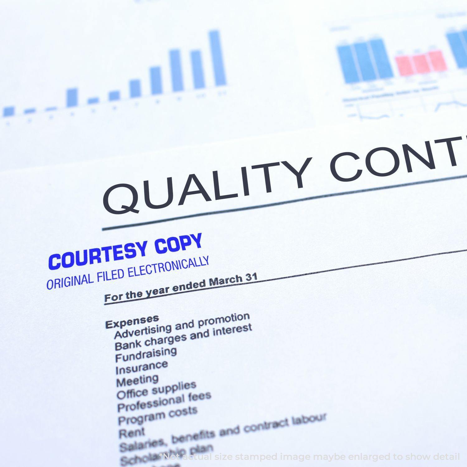 A document stamped with Courtesy Copy Original Filed Electronically Rubber Stamp in blue ink, placed on a financial report.