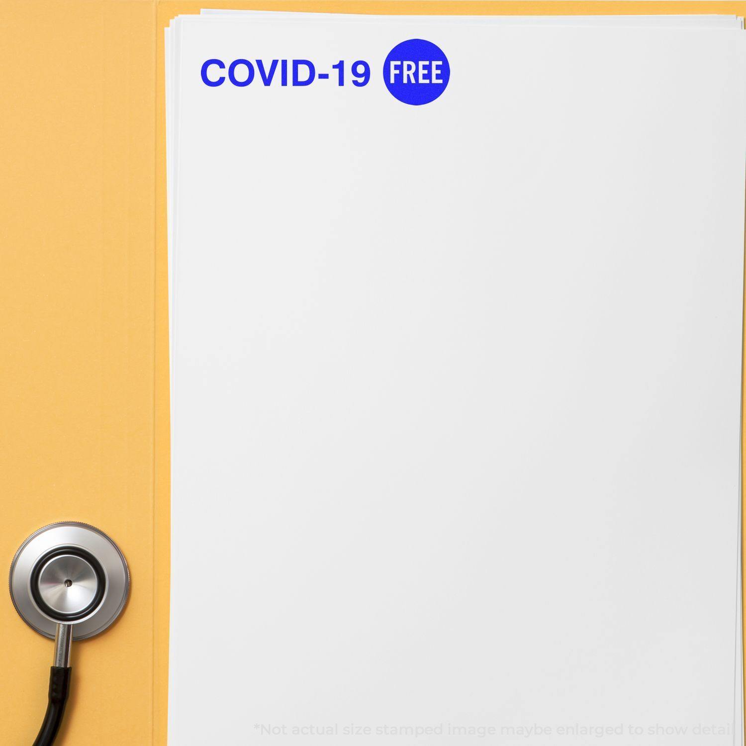 A stethoscope next to a stack of papers stamped with COVID-19 FREE using the Covid-19 Rubber Stamp.