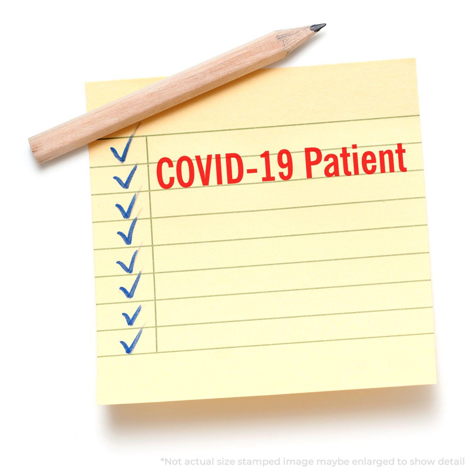 Yellow sticky note with blue checkmarks and COVID-19 Patient stamped in red using the Large Pre-Inked Covid-19 Patient Stamp.