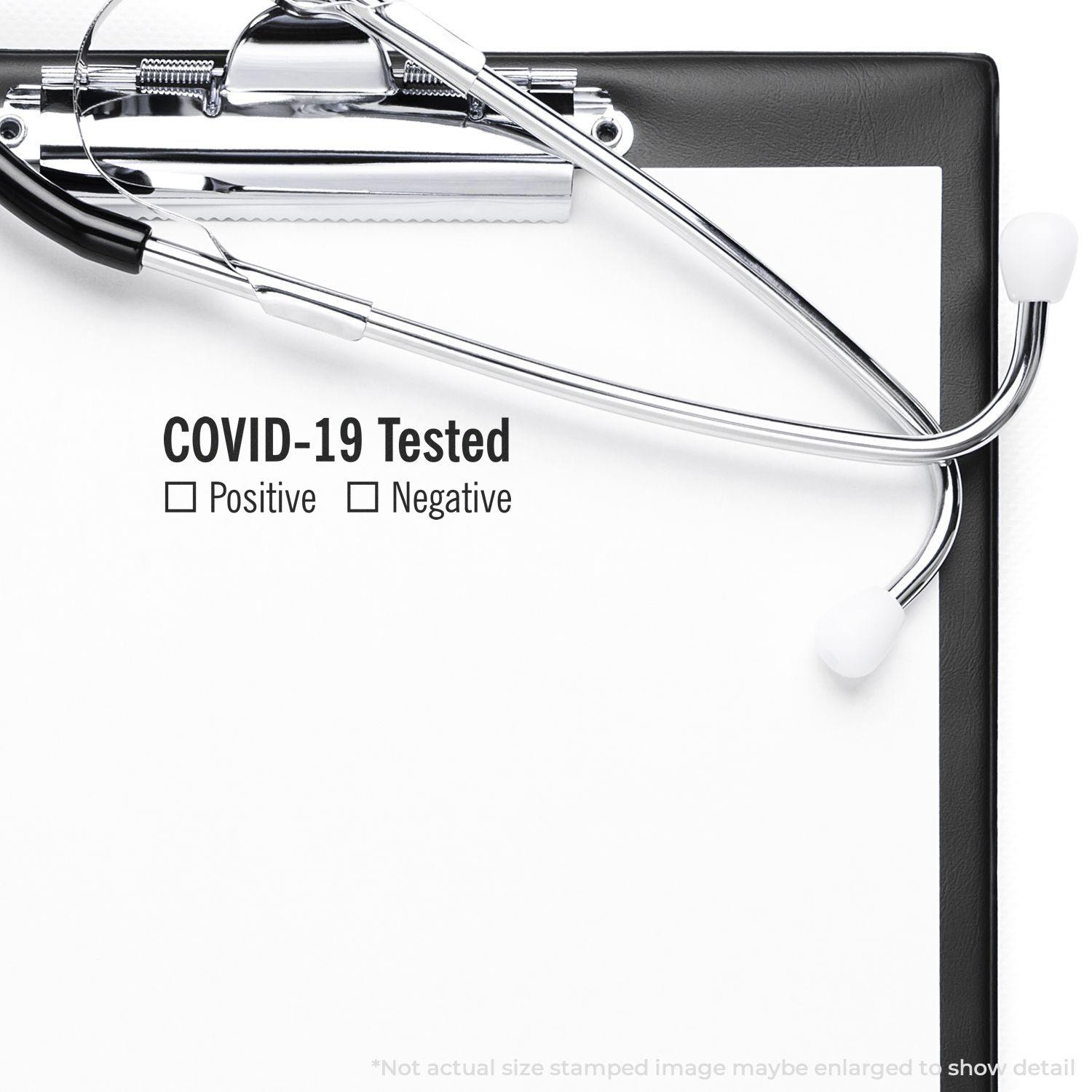 Large Self Inking Covid-19 Tested Stamp marking a clipboard with options for Positive or Negative results, alongside a stethoscope.