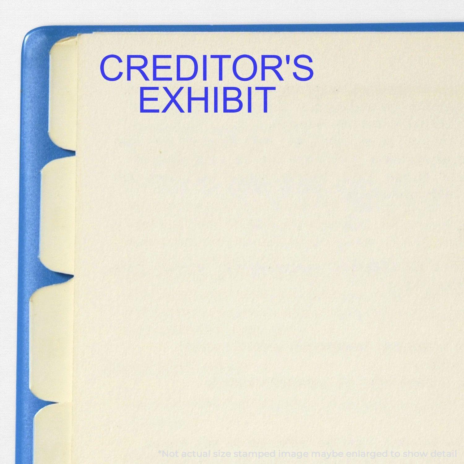 Creditors Exhibit Rubber Stamp used on a file folder with tabbed dividers, showing the stamped text 'CREDITOR'S EXHIBIT' in blue ink.