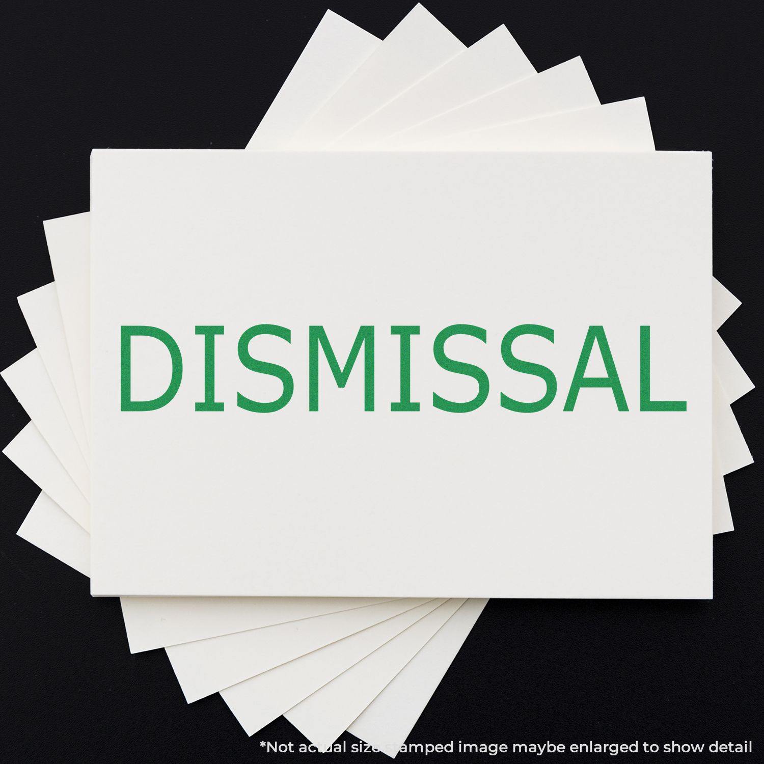 Dismissal Rubber Stamp in green ink on white paper, displayed on a black background with multiple sheets fanned out behind it.