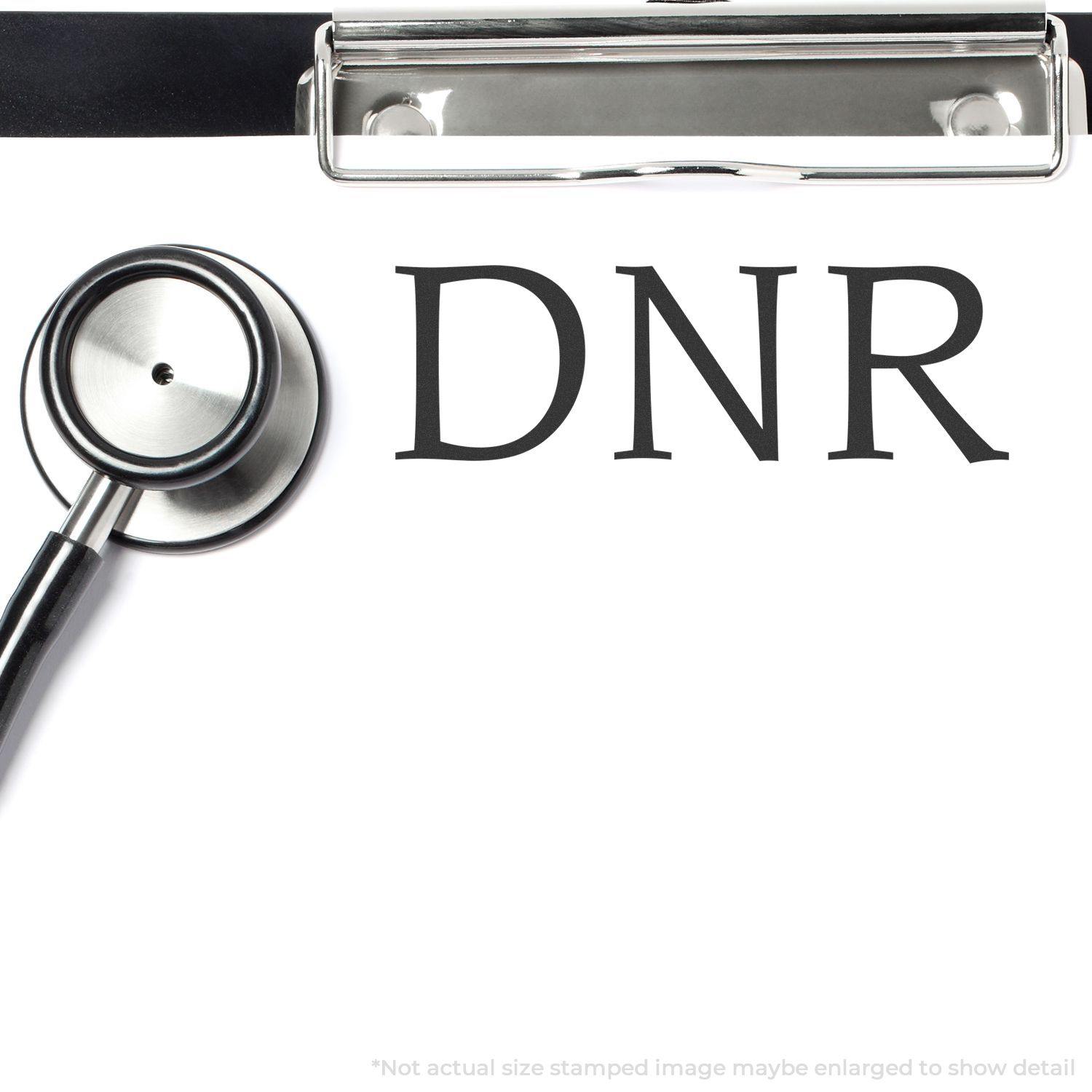 Stethoscope and clipboard with DNR stamped on paper using the DNR Medical Rubber Stamp.