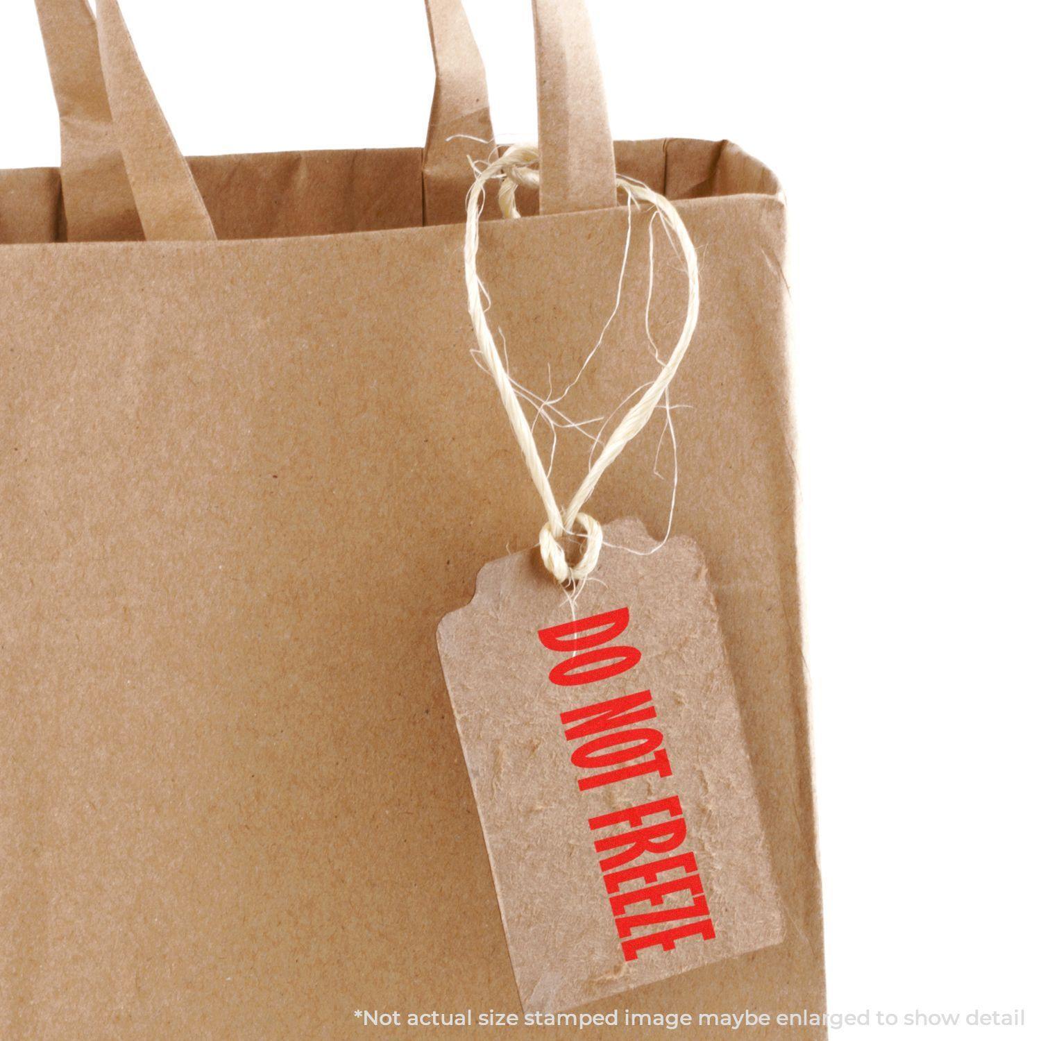 A brown paper bag with a tag stamped DO NOT FREEZE in red ink using the Do Not Freeze Rubber Stamp.