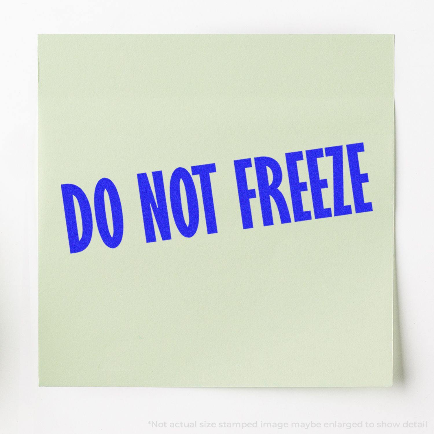 Green paper with blue DO NOT FREEZE text stamped on it using the Do Not Freeze Rubber Stamp.