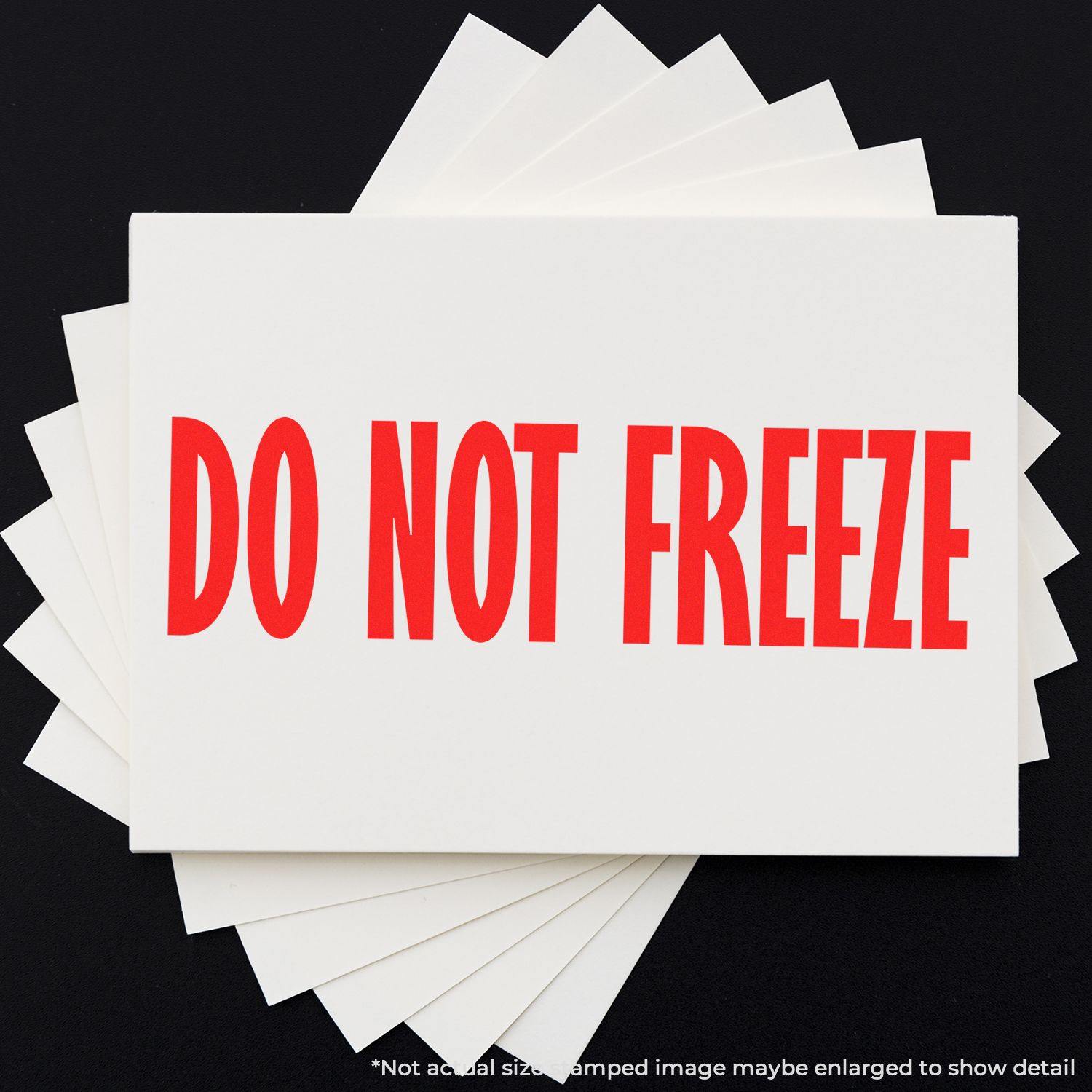 Do Not Freeze Rubber Stamp imprint in bold red letters on white cards, fanned out on a black background.