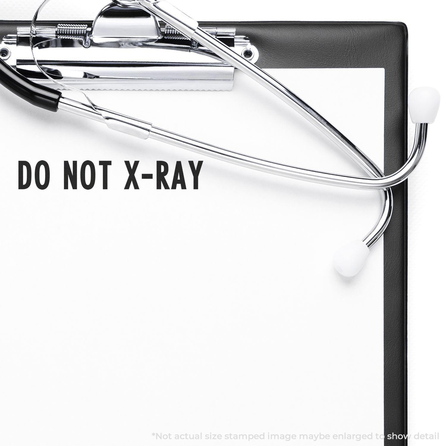 Do Not X-Ray Rubber Stamp impression on a clipboard with a stethoscope, indicating medical documents should not be x-rayed.