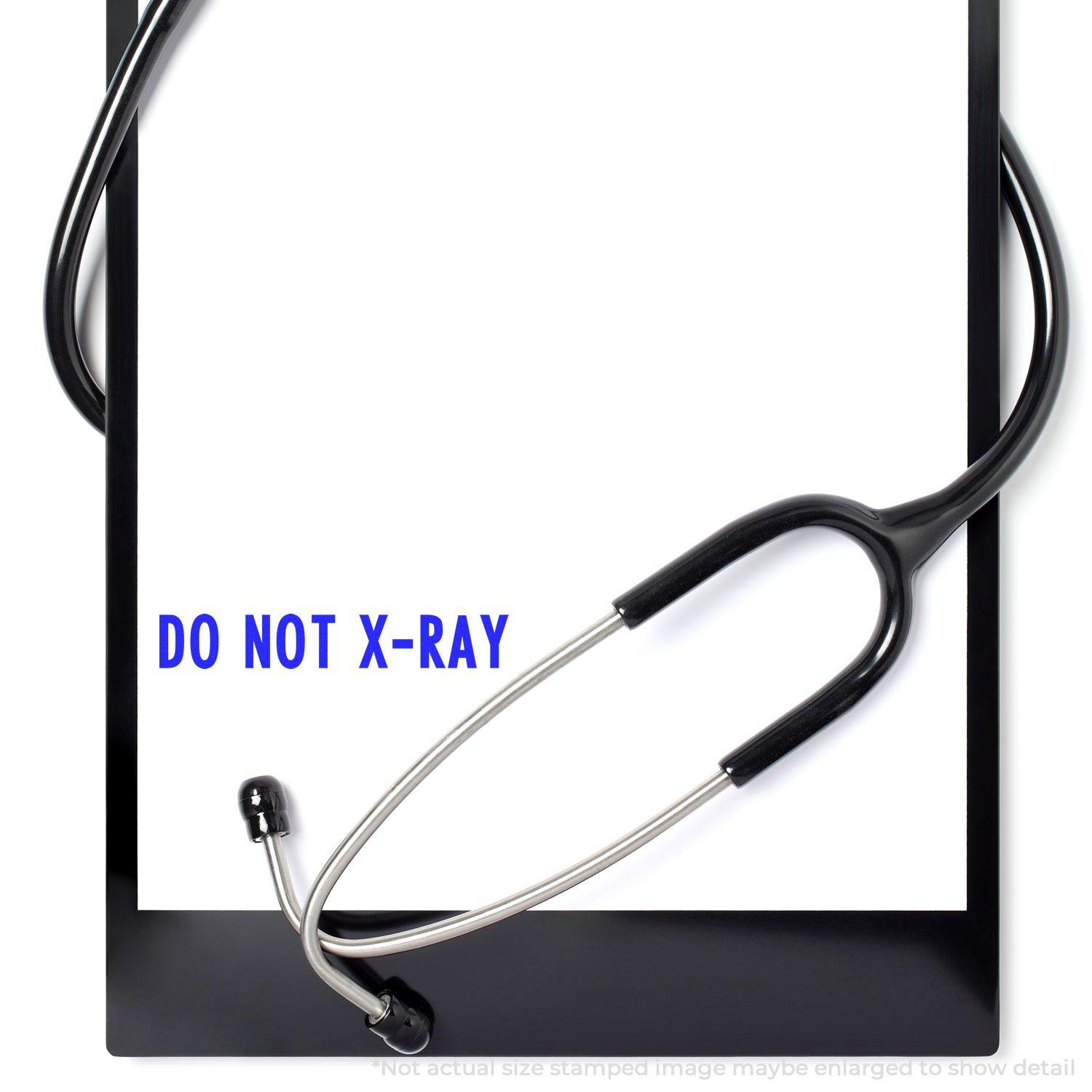 A stethoscope rests on a clipboard with a stamped message reading DO NOT X-RAY using the Do Not X-Ray Rubber Stamp.