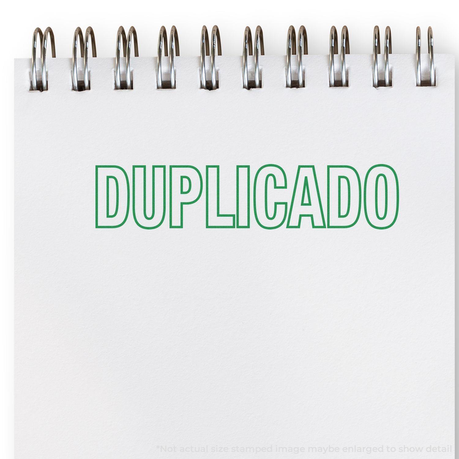 Large Pre-Inked Duplicado Stamp imprinting "DUPLICADO" in green on a white spiral-bound notepad.