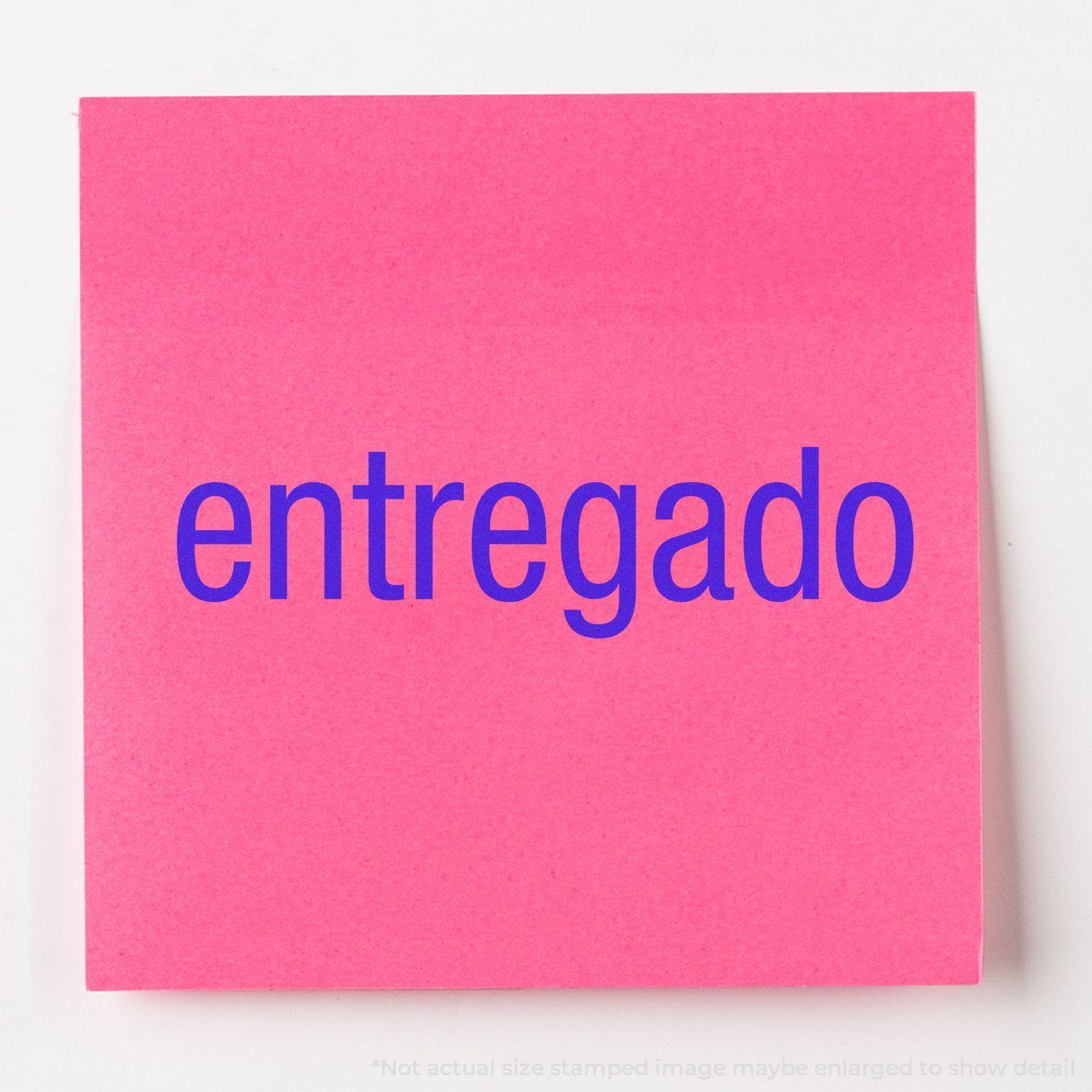 Large Pre-Inked Entregado Stamp in blue ink on a bright pink paper, showcasing the clear and bold stamped text entregado.