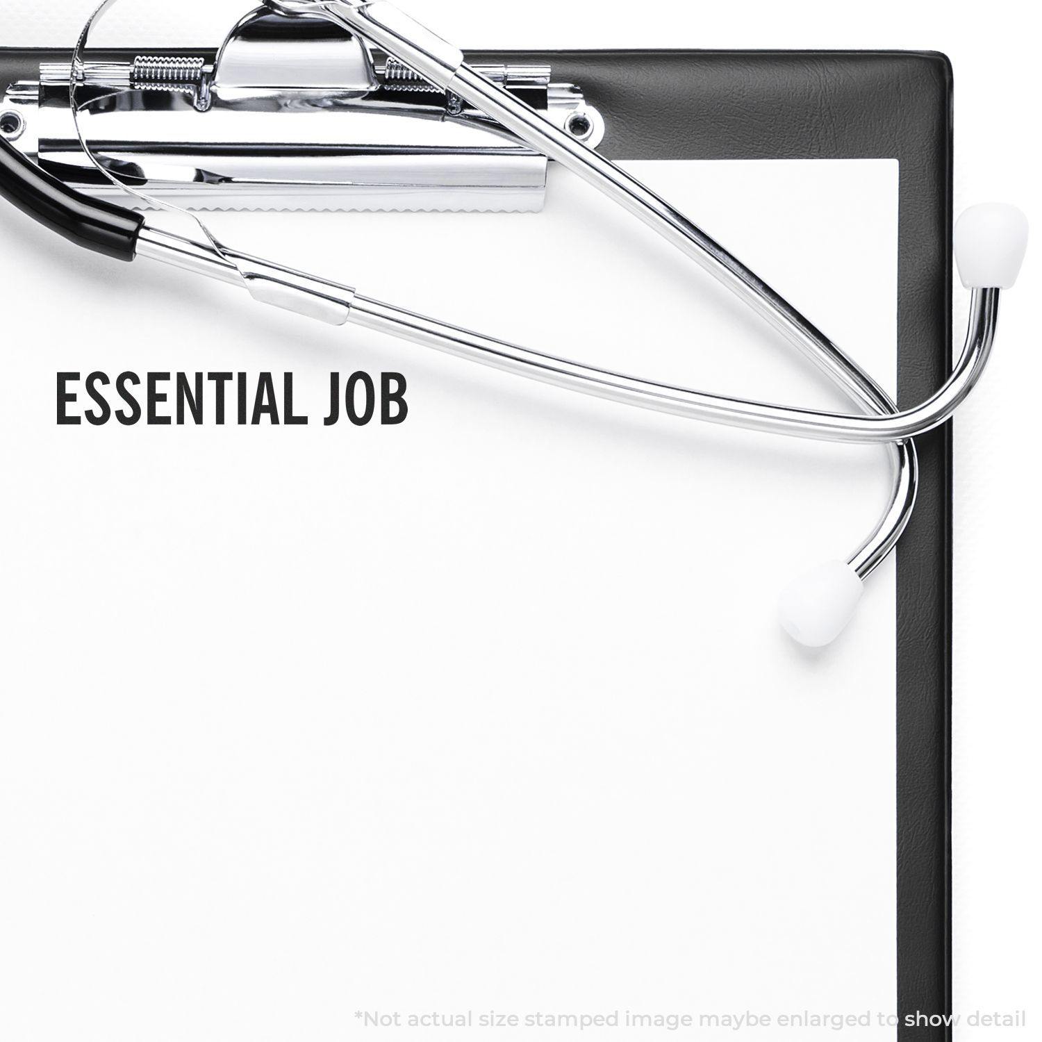 Essential Job Rubber Stamp imprint on a white paper clipped to a black clipboard with a stethoscope placed on top.