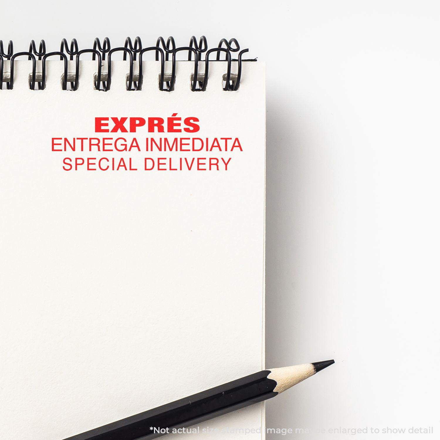 Large Expres Entrega Inmediata Rubber Stamp in red ink on a white notepad with a black pencil beside it.