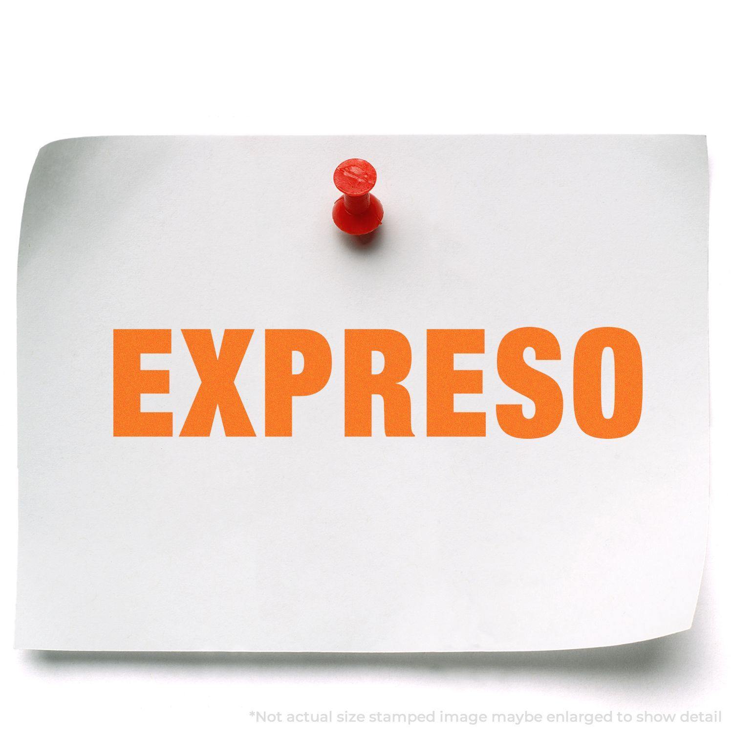 A white paper pinned to a board with a red pushpin, stamped with the word EXPRESO in bold orange letters using the Expreso Rubber Stamp.