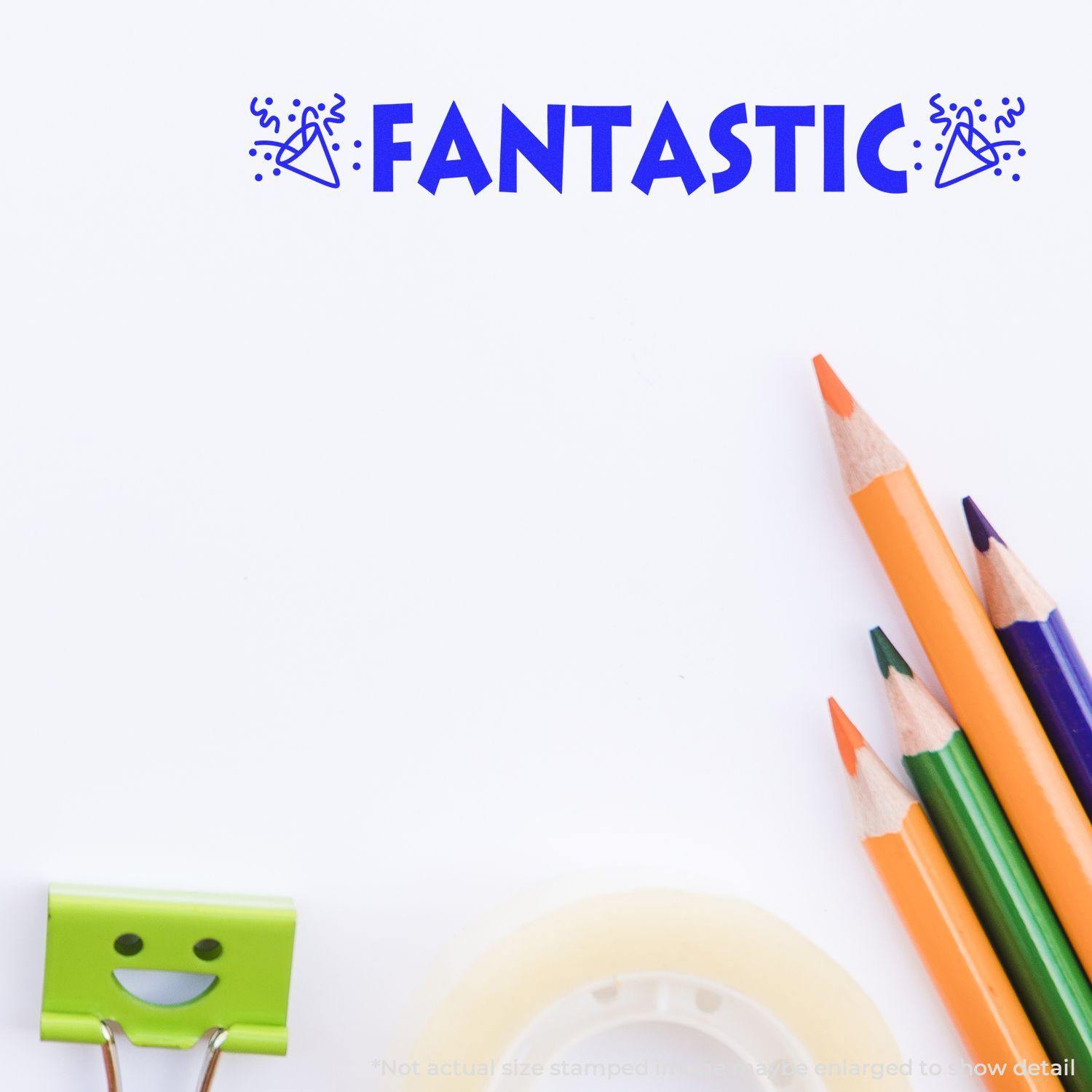 Fantastic with Icons Rubber Stamp impression on paper, surrounded by colorful pencils, a smiling binder clip, and tape.