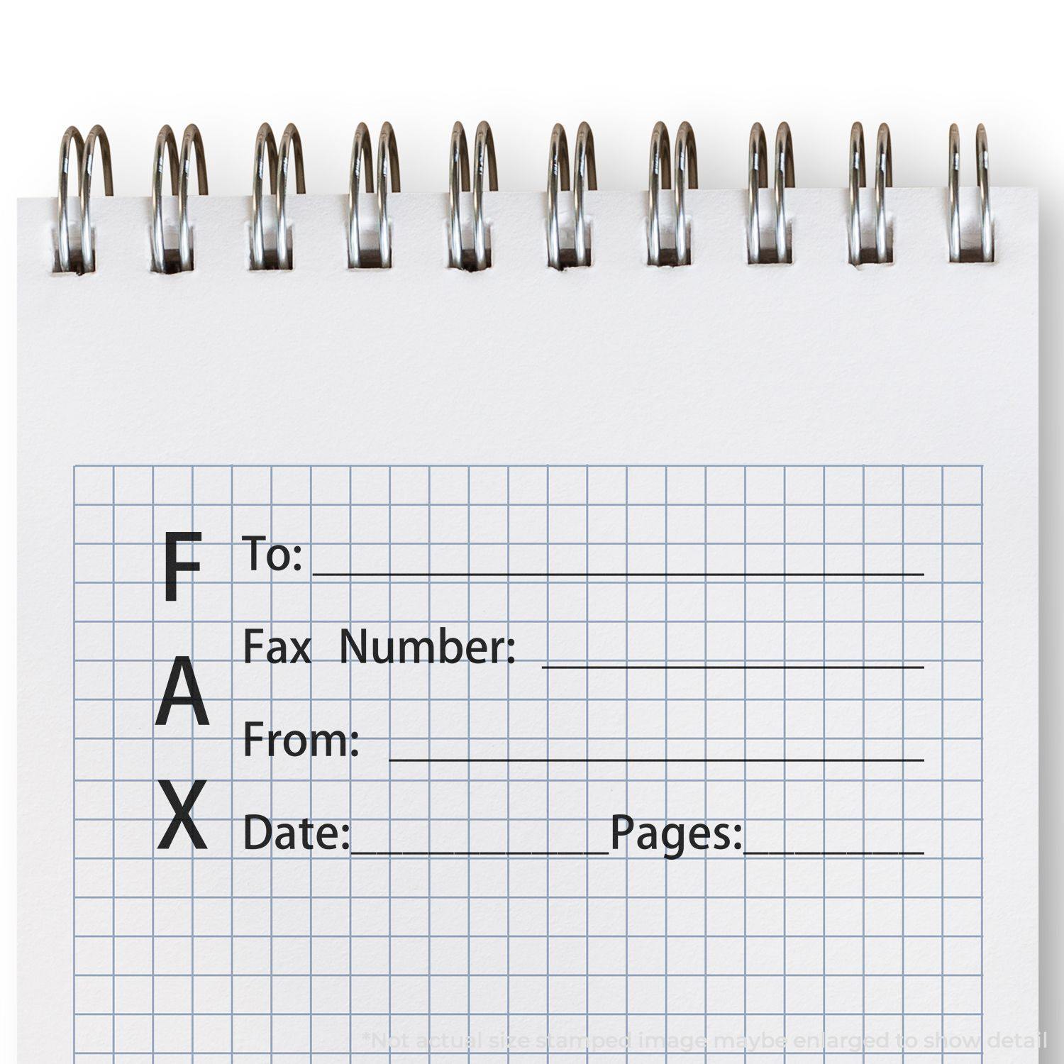 A Slim Pre-Inked Fax It 1 Stamp imprint on a spiral notebook with sections for To, Fax Number, From, Date, and Pages.