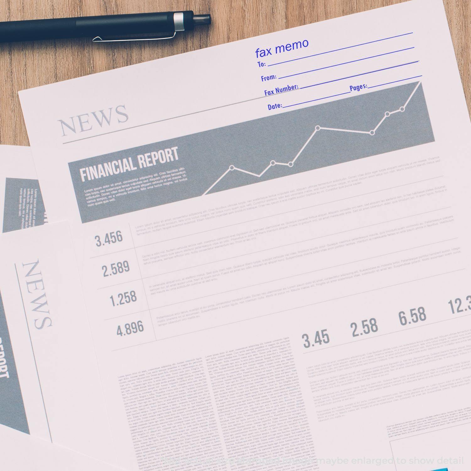 A Fax It 2 Rubber Stamp is used on a fax memo sheet placed on top of financial reports and a pen on a wooden desk.