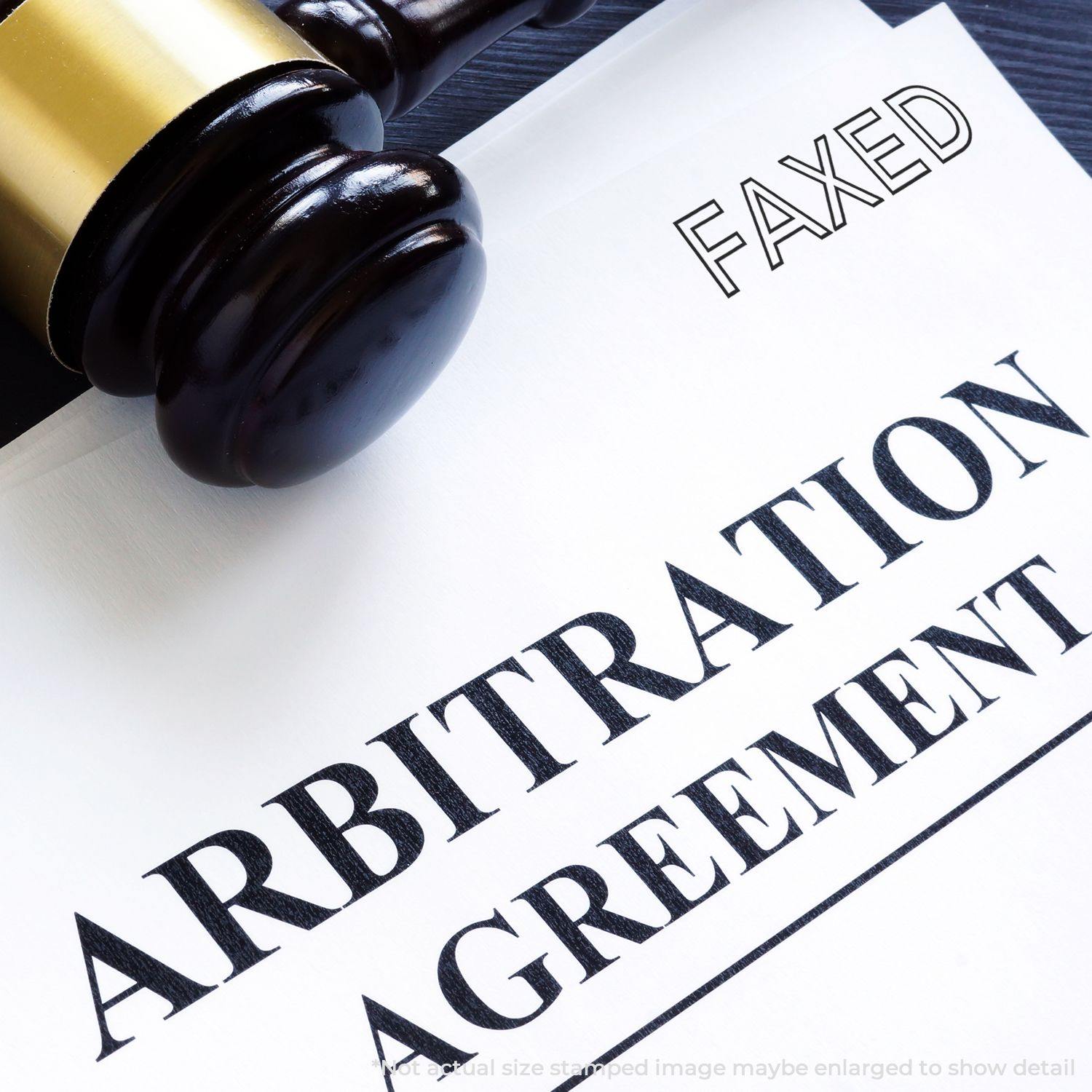 Slim Pre-Inked Faxed Stamp on an arbitration agreement document with a gavel in the background.