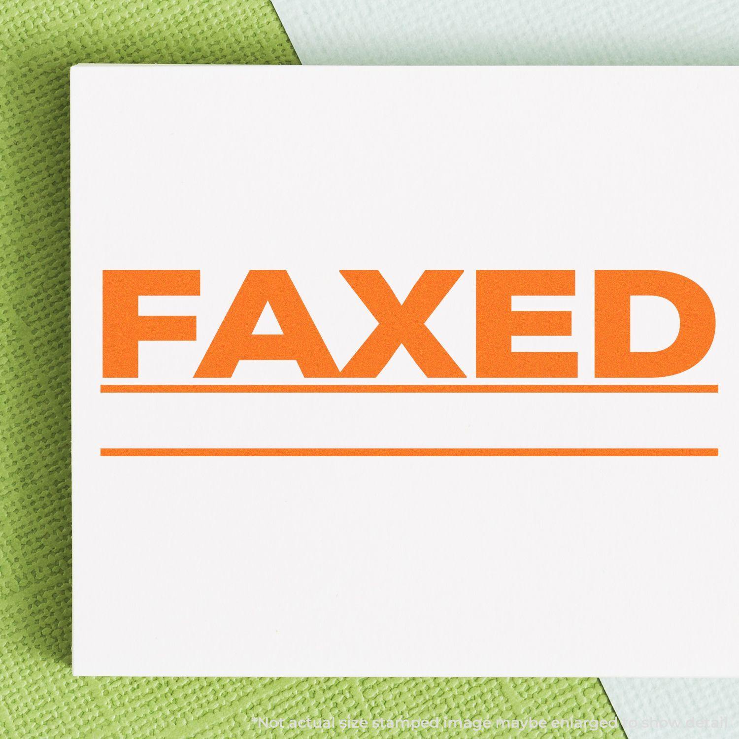 Stamped paper with 'FAXED' in bold orange letters and a line underneath, created using the Faxed with Line Rubber Stamp.