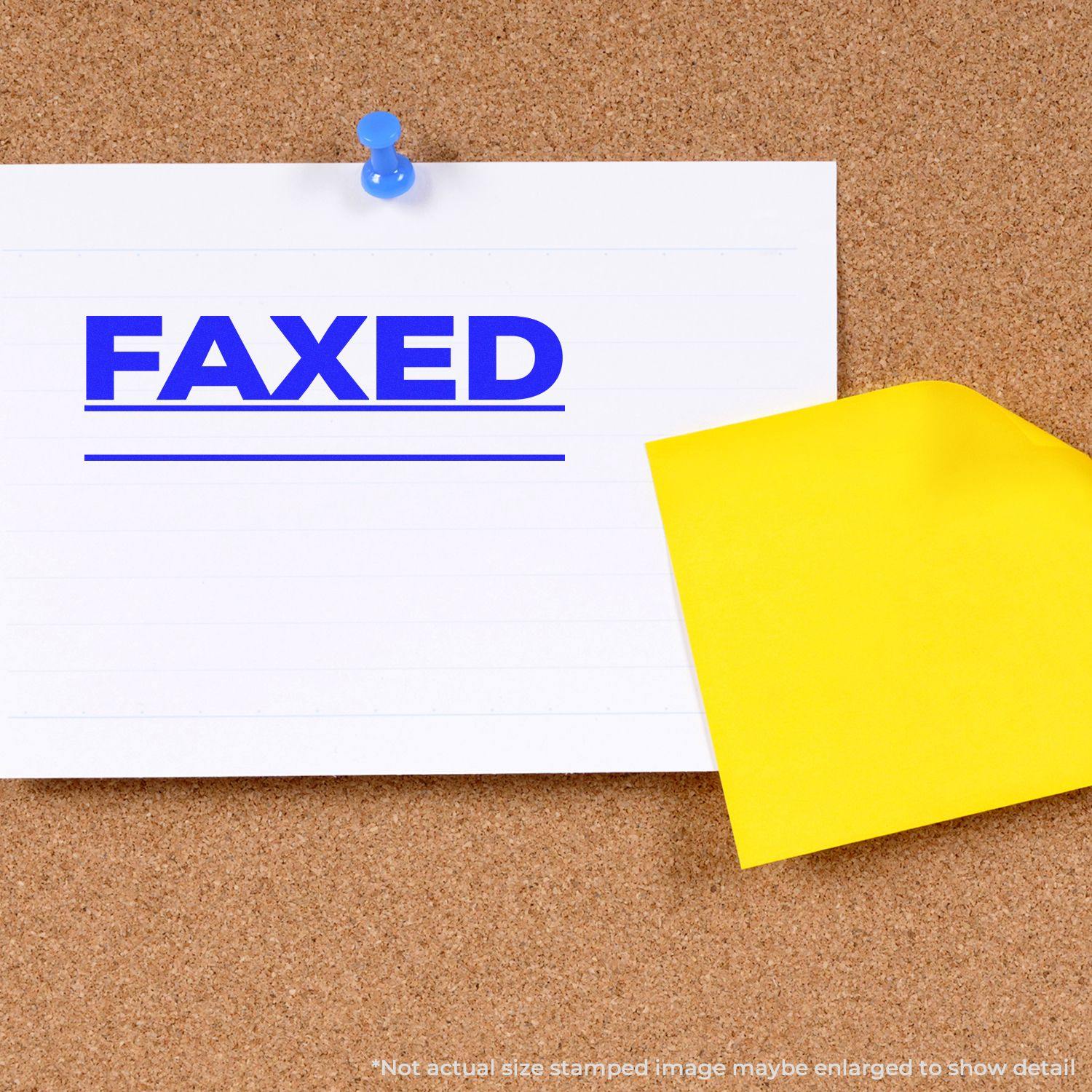 A white paper with FAXED and a line stamped in blue using the Faxed with Line Rubber Stamp, pinned to a corkboard with a yellow sticky note.