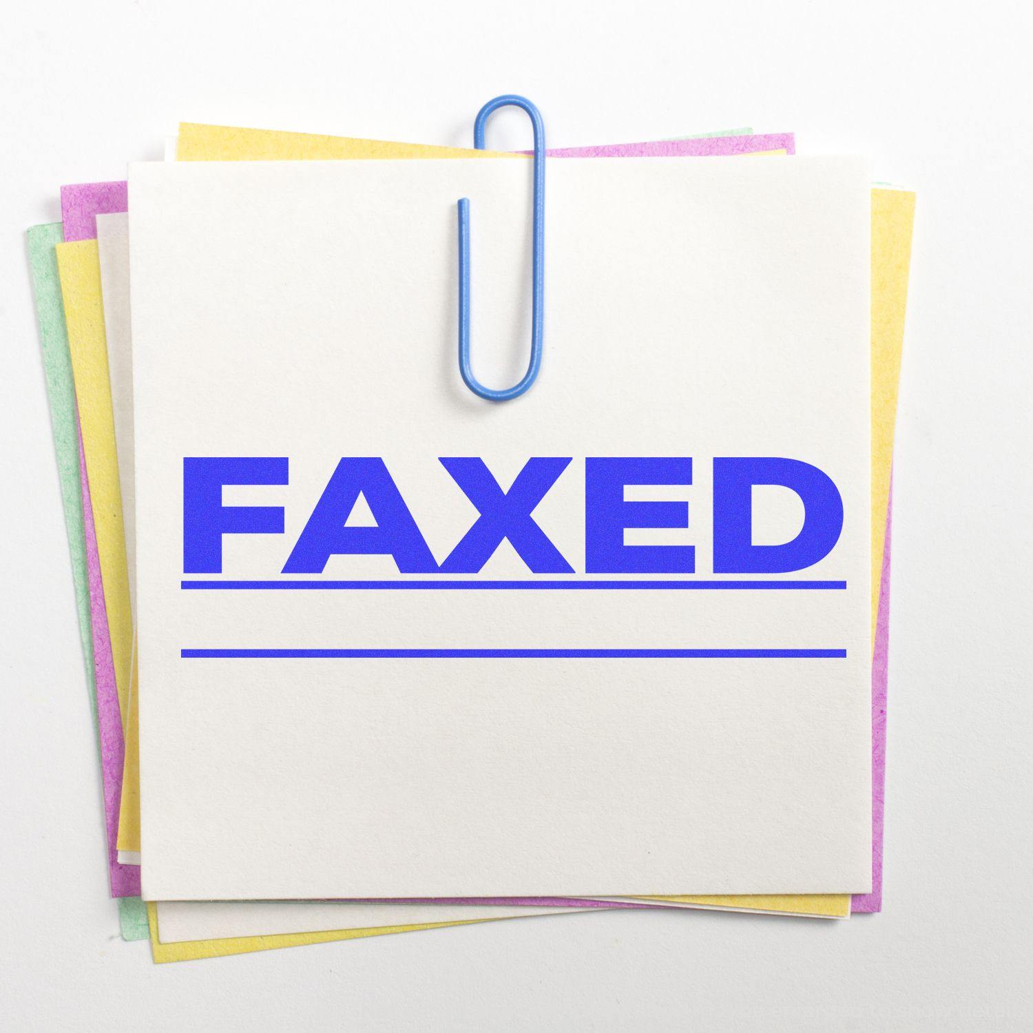 A stack of colorful papers with a blue paperclip and a Faxed with Line Rubber Stamp imprint in bold blue letters on the top sheet.