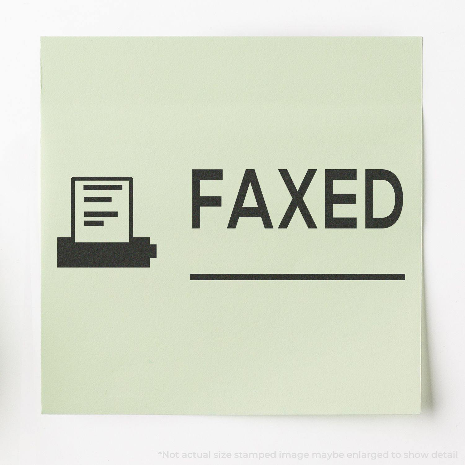 A green paper stamped with FAXED and an icon of a fax machine using the Faxed with Machine Rubber Stamp.