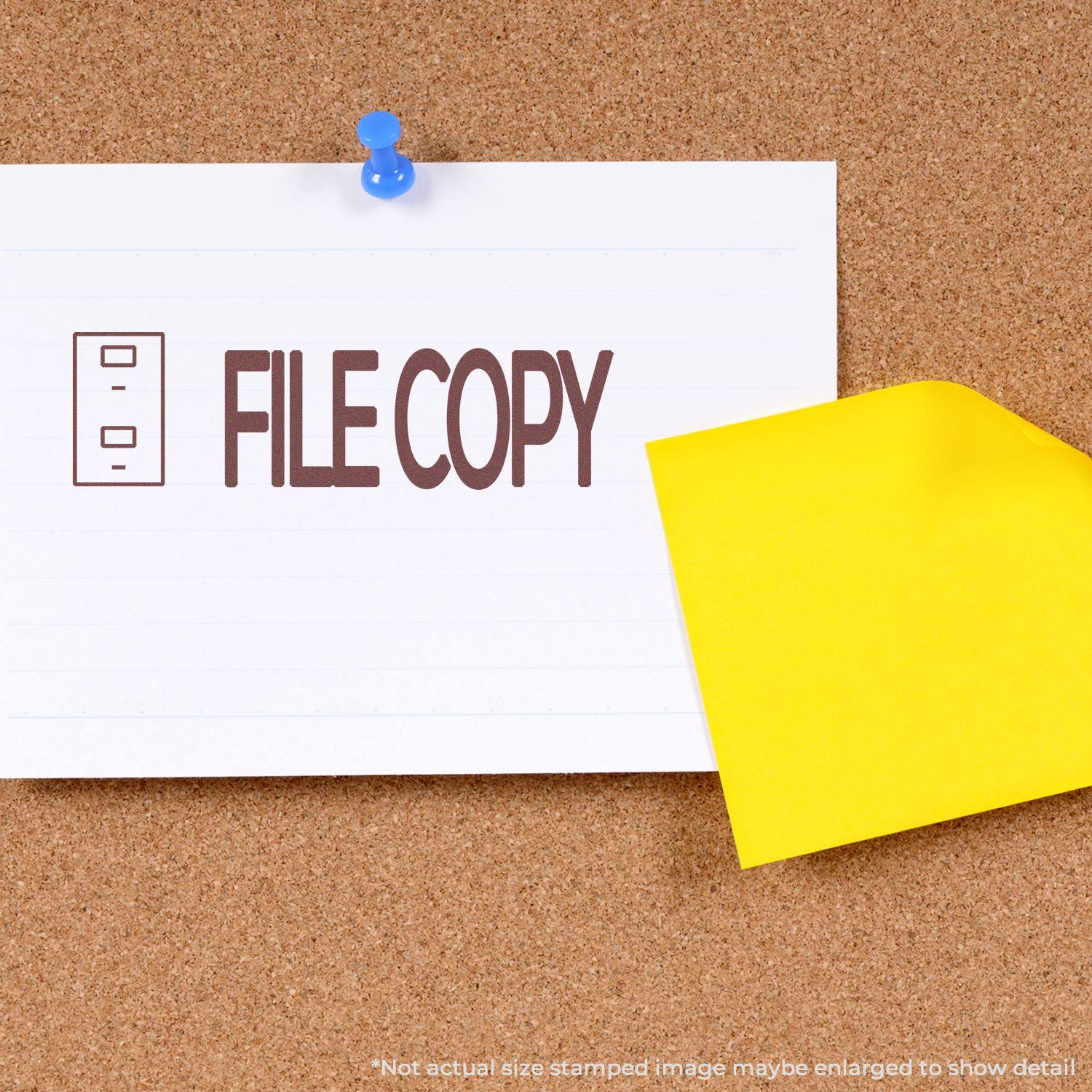 Large Self Inking File Copy with Drawer Stamp marking a paper pinned to a corkboard, with a yellow sticky note partially covering it.