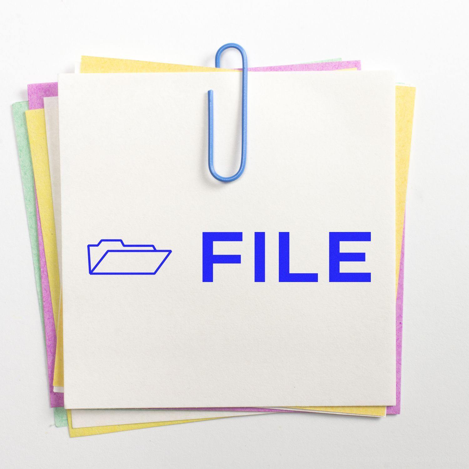 Large Pre-Inked File with Envelope Stamp on a stack of colorful papers, secured with a blue paperclip.