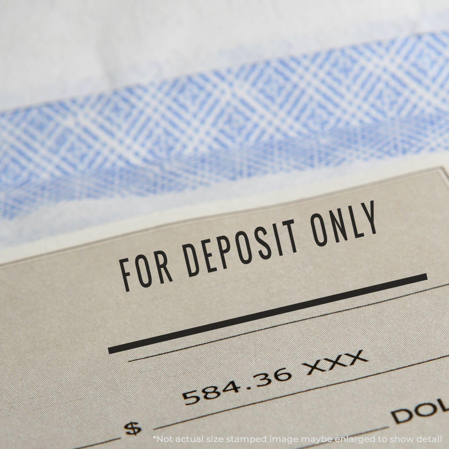 Close-up of a check stamped with For Deposit Only using the Self Inking For Deposit Only with Line Stamp.