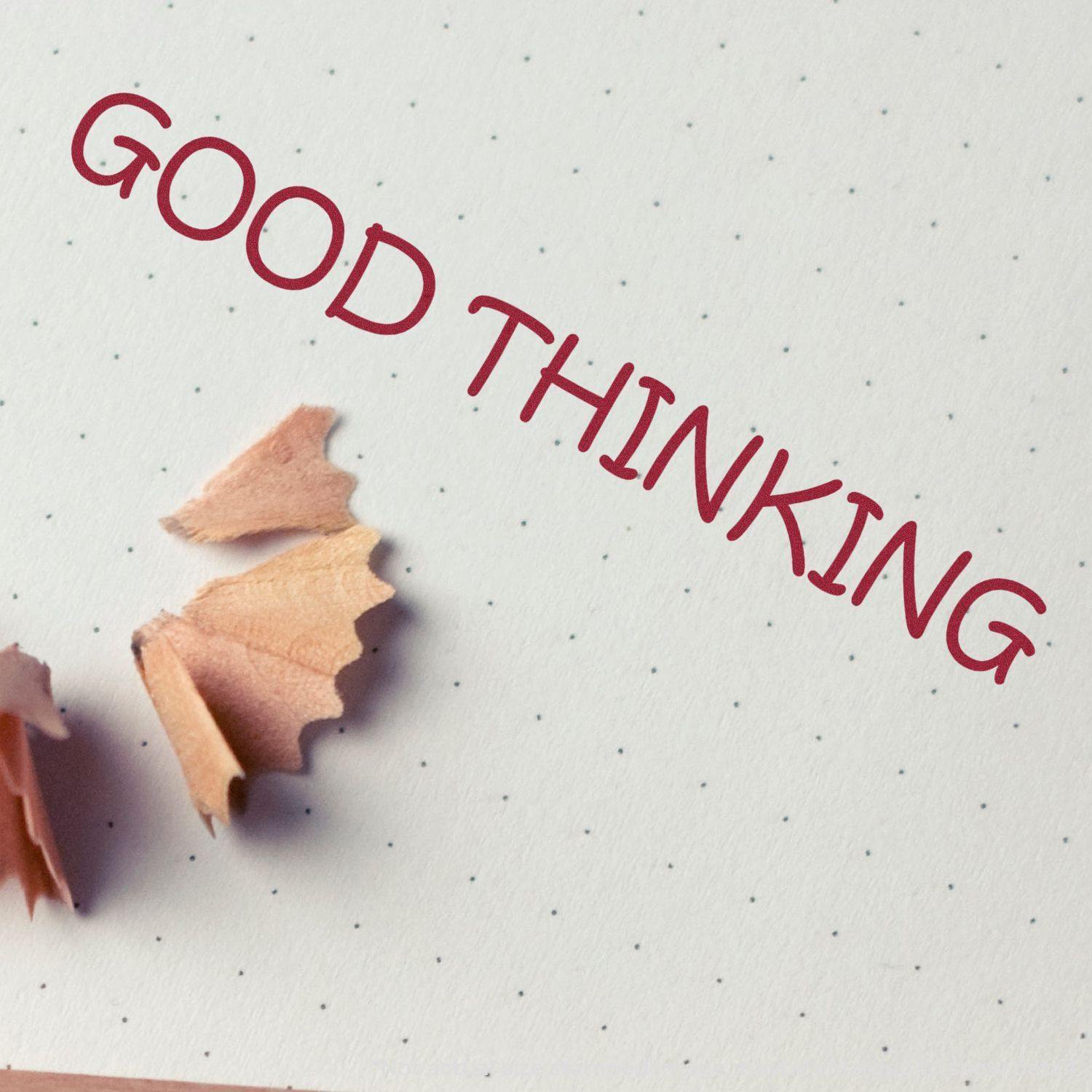 Good Thinking Rubber Stamp imprint on dotted paper with pencil shavings nearby.