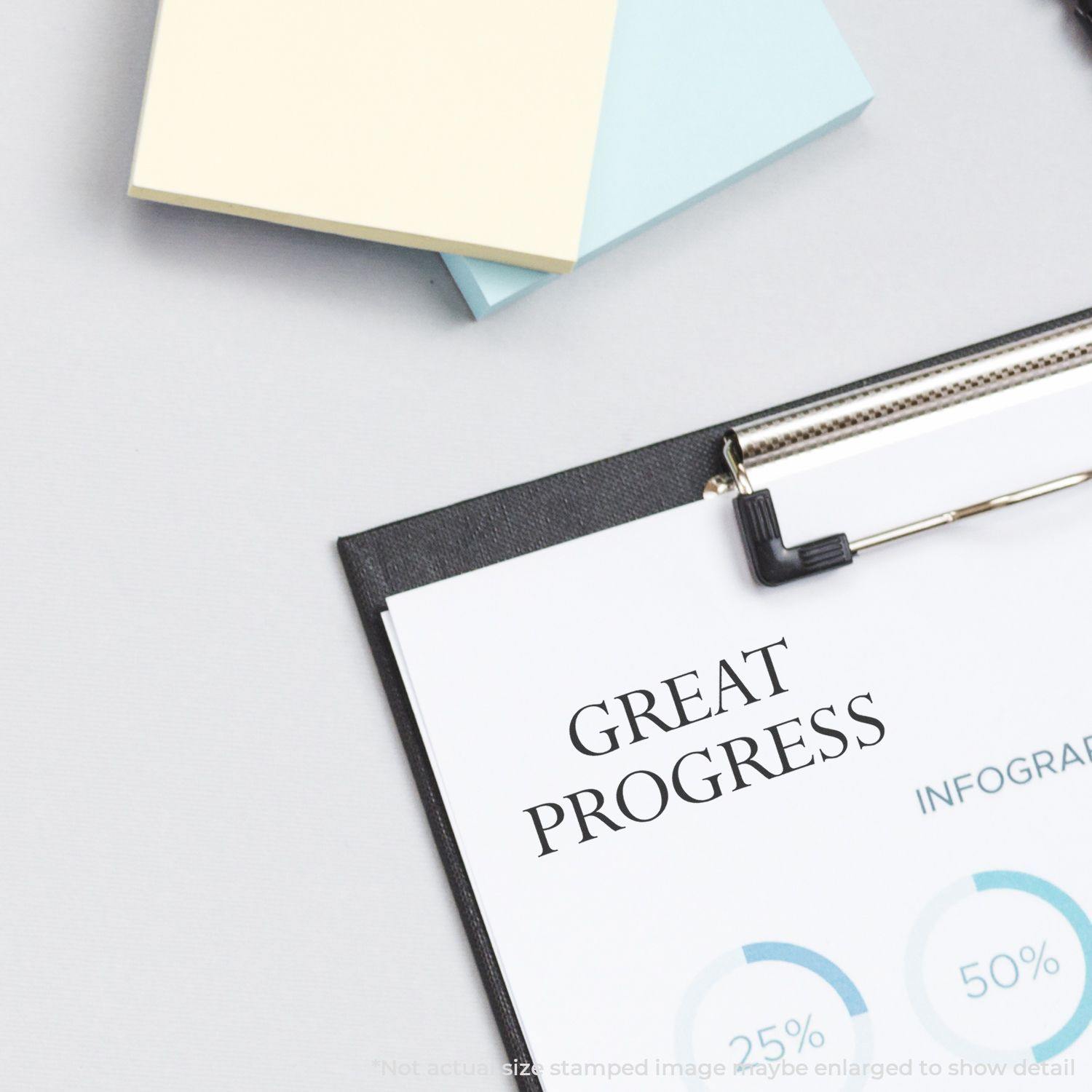 Great Progress Rubber Stamp used on a document with charts, next to sticky notes and a clipboard.