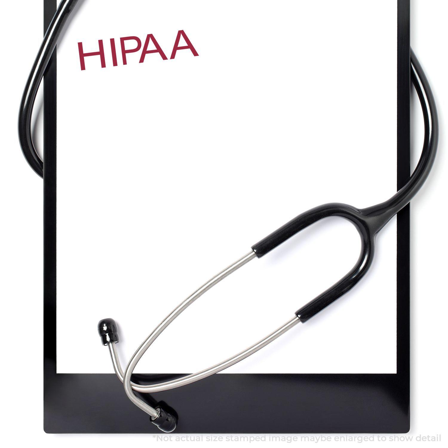 Large Pre-Inked HIPAA Stamp used on a clipboard with a stethoscope, indicating compliance with medical privacy regulations.