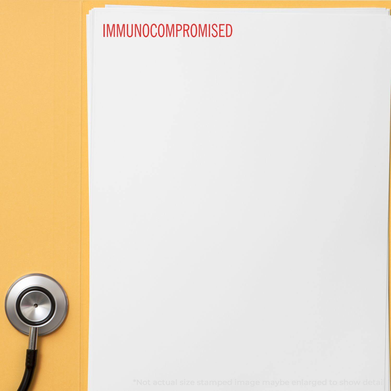 A stethoscope next to a stack of papers stamped with IMMUNOCOMPROMISED in red using the Immunocompromised Rubber Stamp.