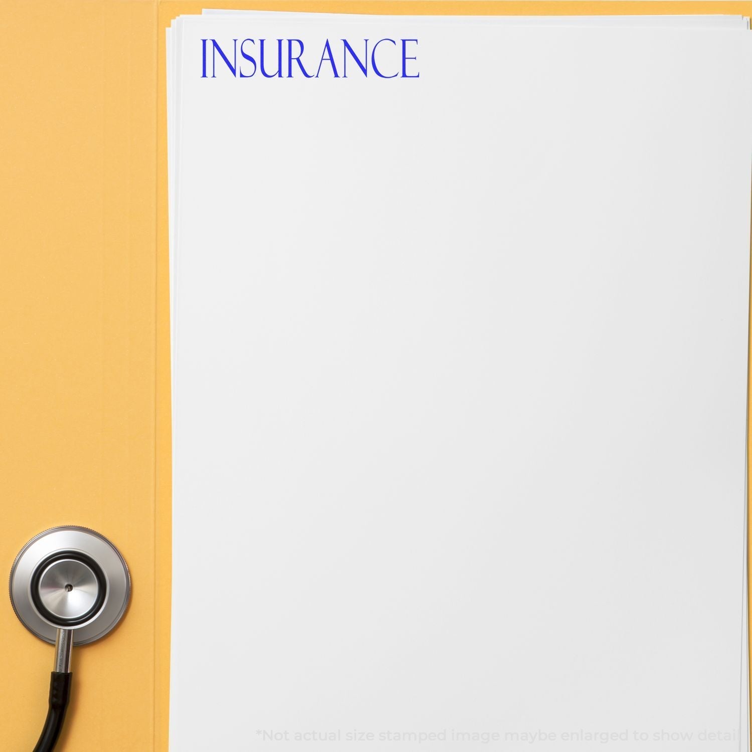 A Self Inking Insurance Stamp marks INSURANCE in blue on a white document, with a stethoscope beside it on a yellow surface.