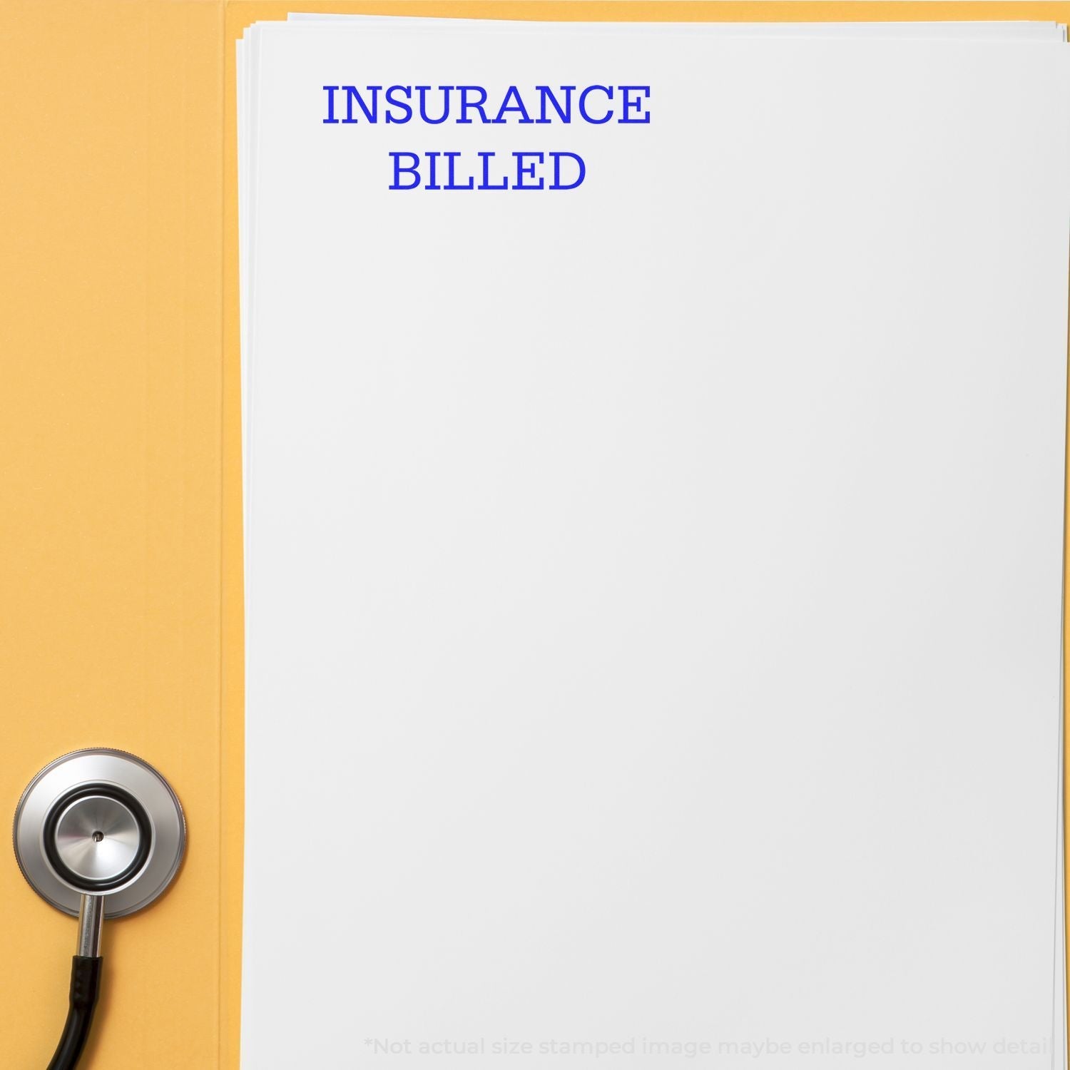 Self Inking Insurance Billed Stamp marking INSURANCE BILLED in blue on a white document, with a stethoscope nearby on a yellow surface.