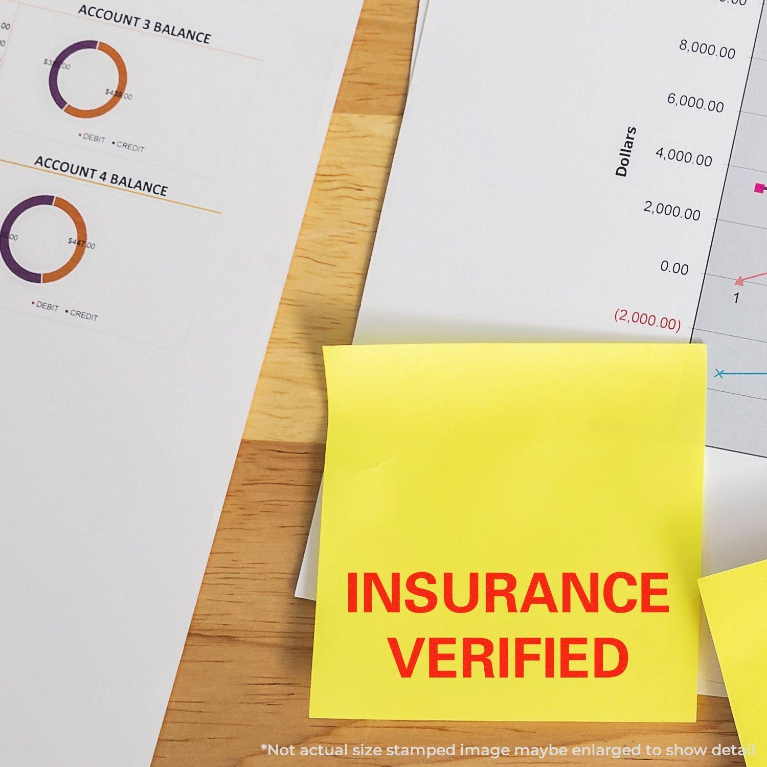 Large Self Inking Insurance Verified Stamp used on a yellow sticky note, placed on financial documents with charts and graphs.