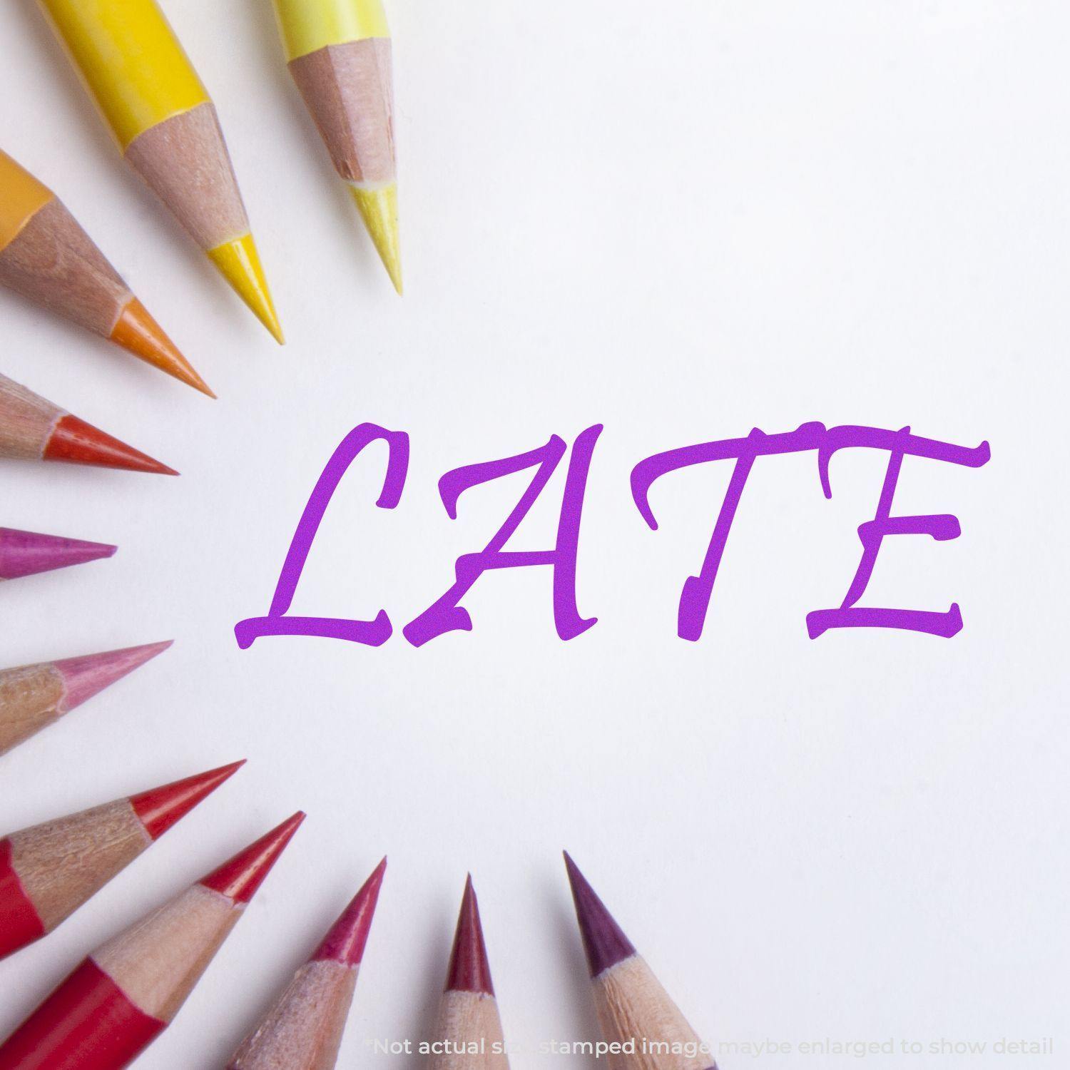 Colored pencils encircle the word LATE stamped in purple ink using the Large Late Rubber Stamp on white paper.