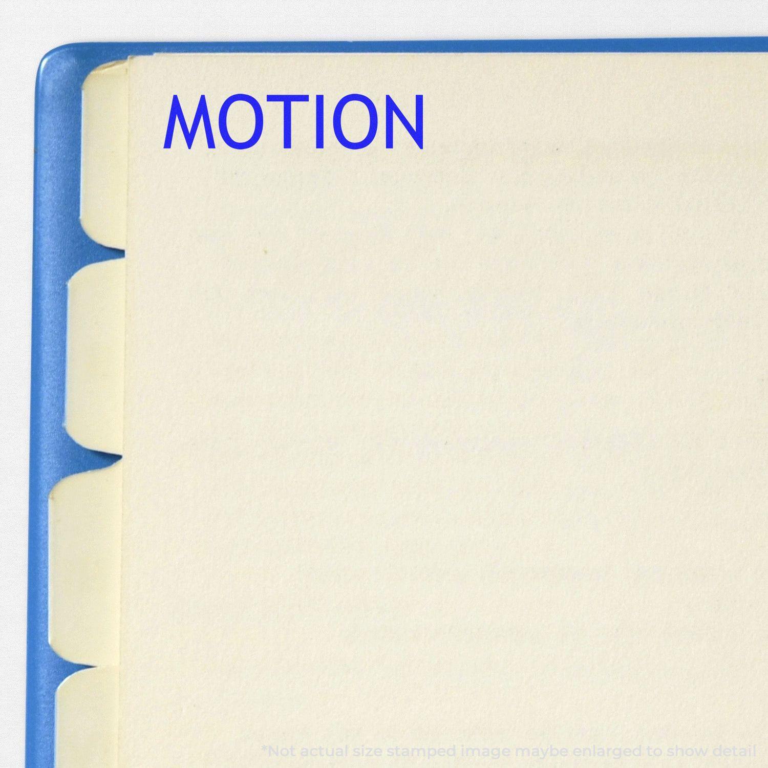 Large Self Inking Motion Stamp used on a file folder, stamping the word MOTION in blue ink on a tabbed document.