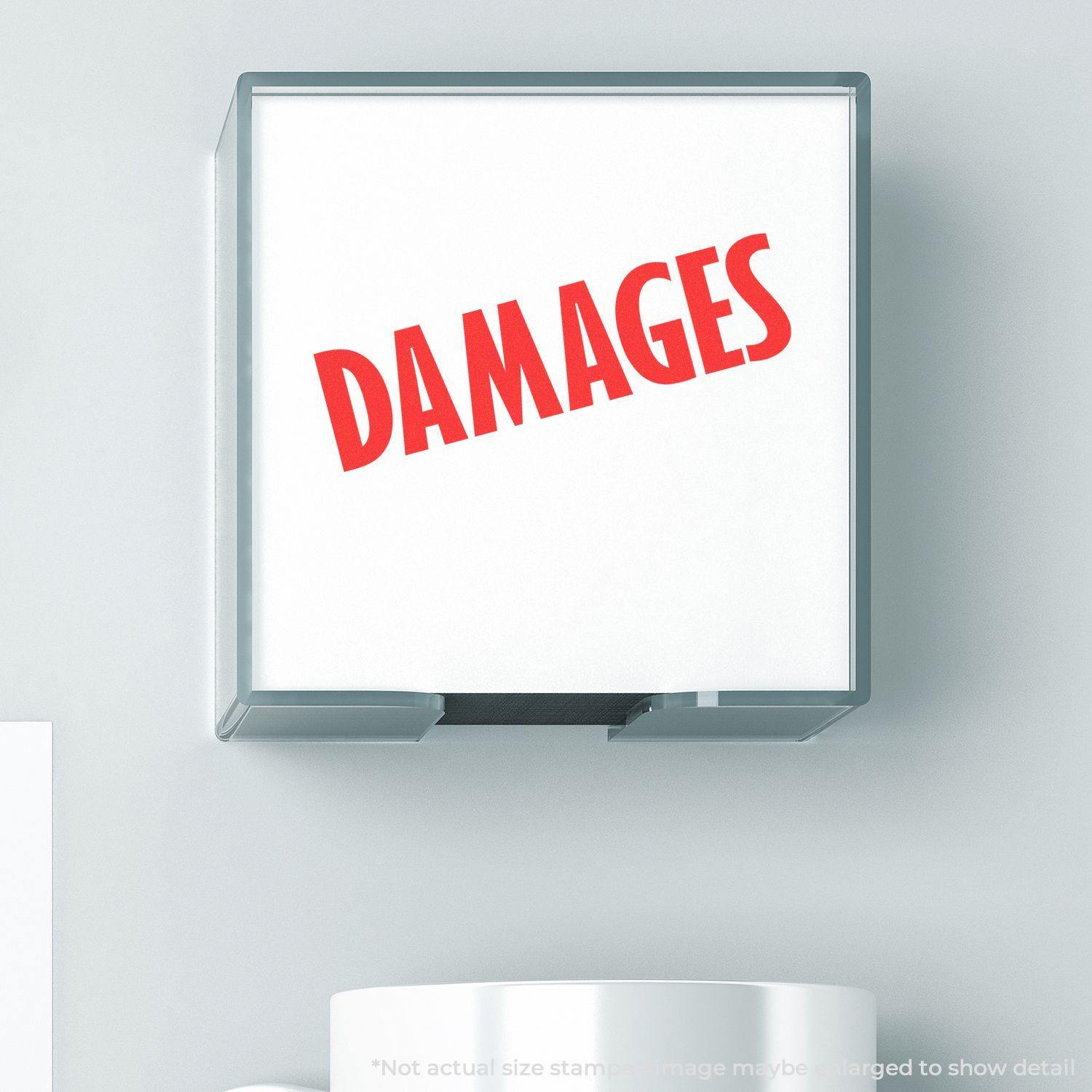 Large Self Inking Damages Stamp with red DAMAGES text on a white background, shown in use on a light-colored surface.