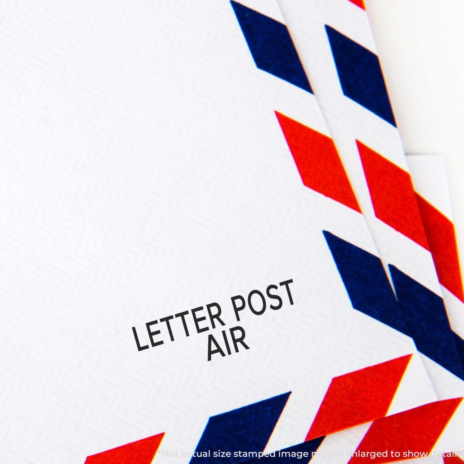 Close-up of an envelope stamped with LETTER POST AIR using the Large Letter Post Air Rubber Stamp, featuring red and blue chevron borders.