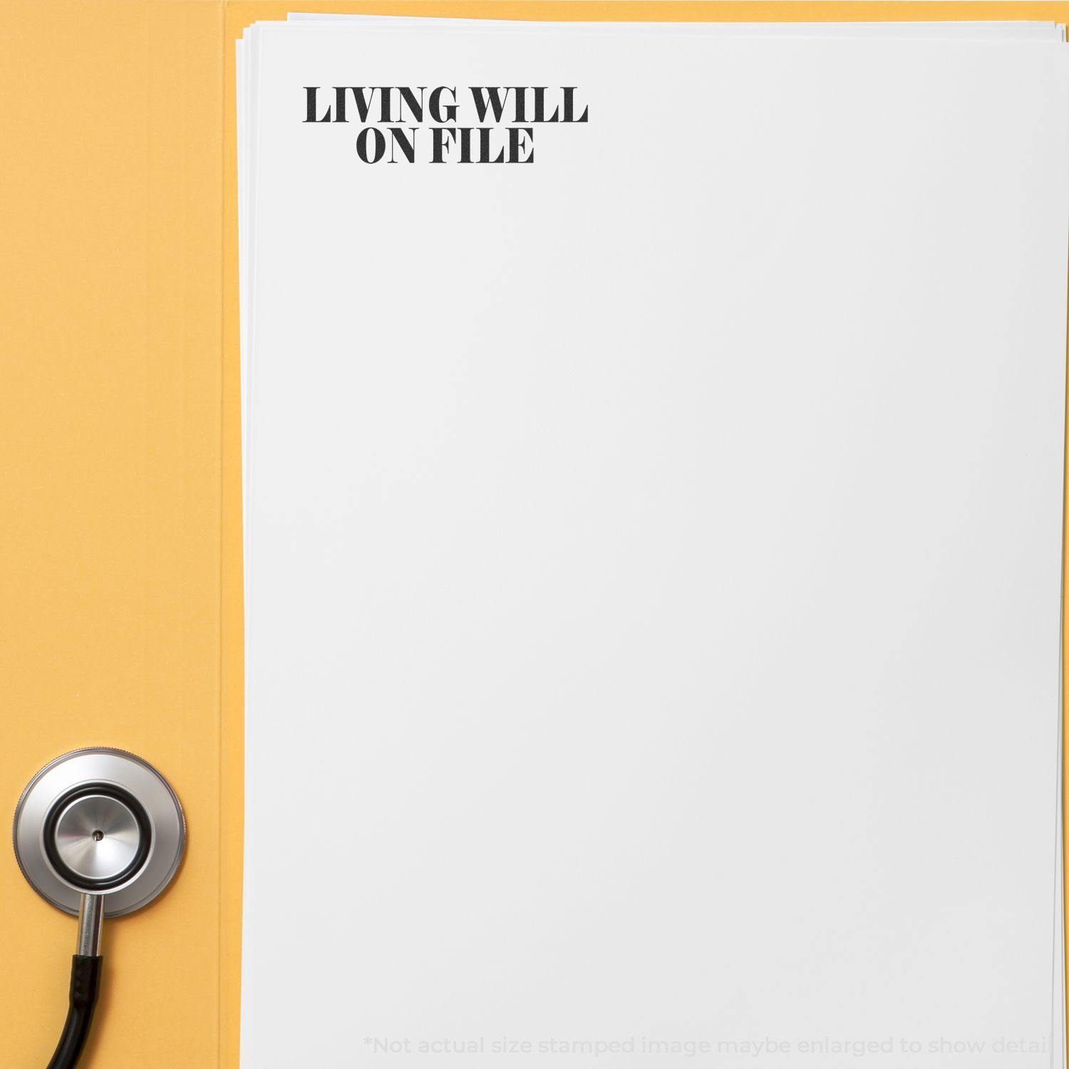 Large Pre-Inked Living Will On File Stamp used on a stack of white papers with a stethoscope beside them on a yellow background.