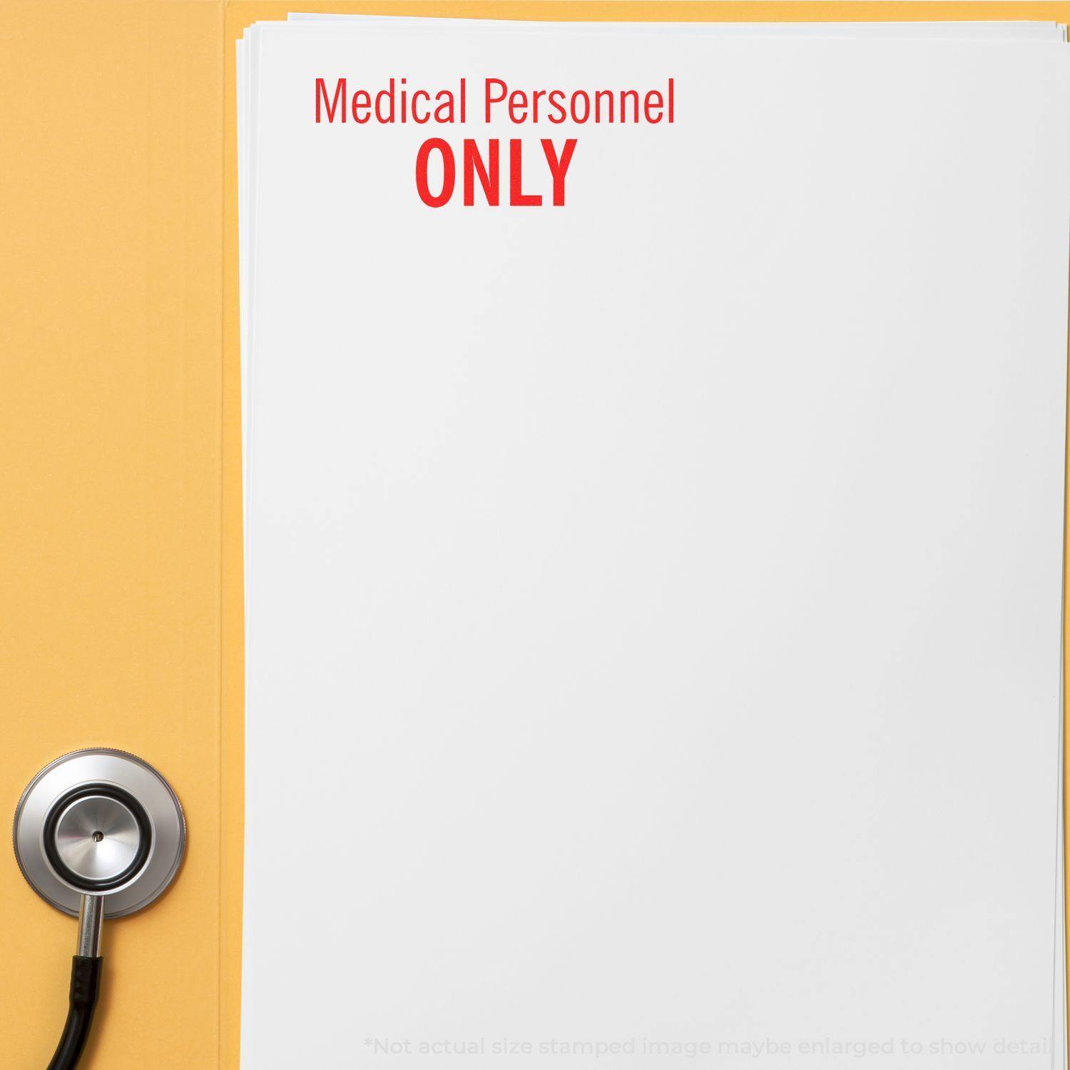 Large Medical Personnel Only Rubber Stamp used on a stack of papers with a stethoscope nearby.